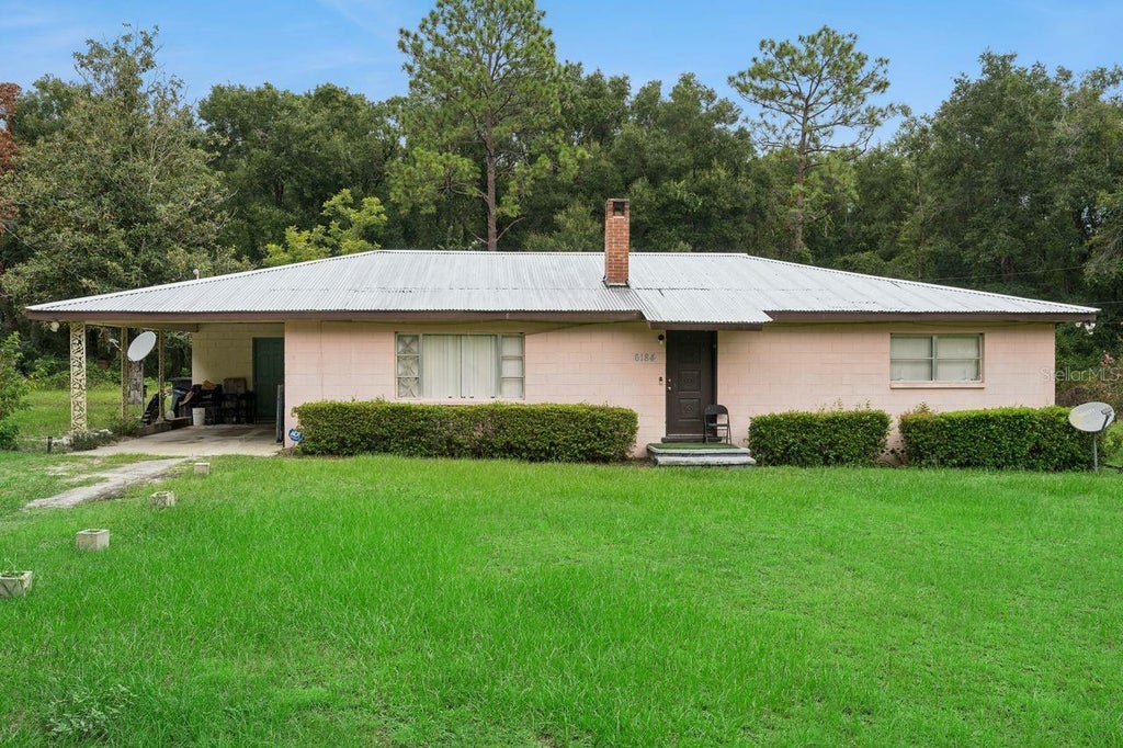 Photo of 6184 NE 54th Boulevard, Wildwood, FL 34785 (MLS # TB8534432)