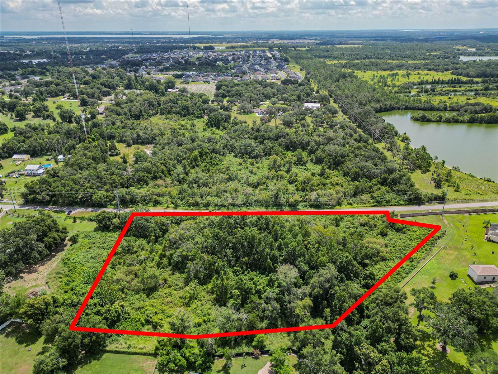 Discover the possibilities with this 4.09-acre parcel in a prime Lakeland setting! Situated near 540A and adjacent to the desirable Lakeland Highlands, this spacious plot offers a world of potential—ideal for an investment, a personal retreat, or exploring the possibility of building your vision from the ground up. Some clearing may be needed, making it a true blank canvas.
The location shines with access to trending dining and culture, scenic parks and trails, architectural heritage, and easy connectivity between Tampa and Orlando. Whether you’re planting roots or holding for the future, this land offers both promise and possibility. Ensure you speak with the appropriate municipal authority regarding this property and your needs! Owner Financing could be a possibility with the right terms!