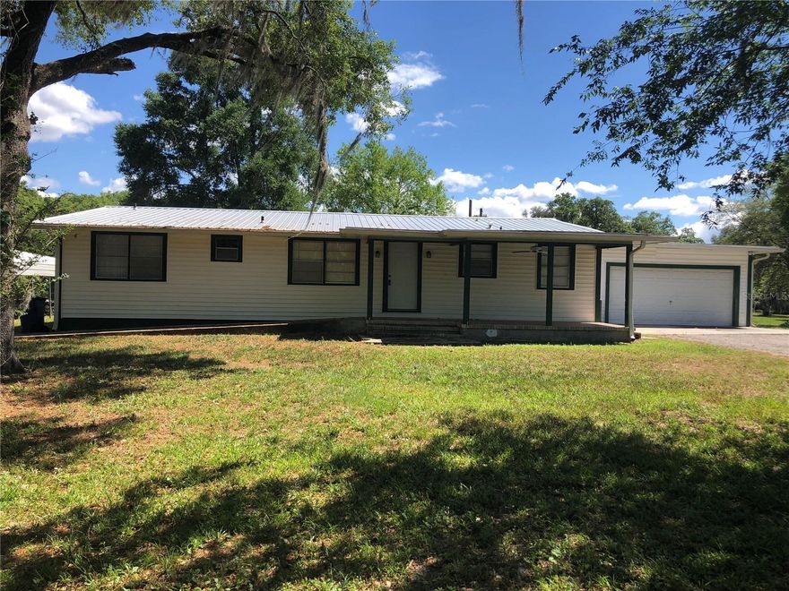 This 4 Bedroom, 3 Bath home is located in the Heart of Newberry. Home sits on a 1/2 an acre with a 2-car garage and is surrounded by 12 acres of vacant land.  Approximately 1976 square feet of living space.  Enclosed Sunroom that leads out to fenced back yard.