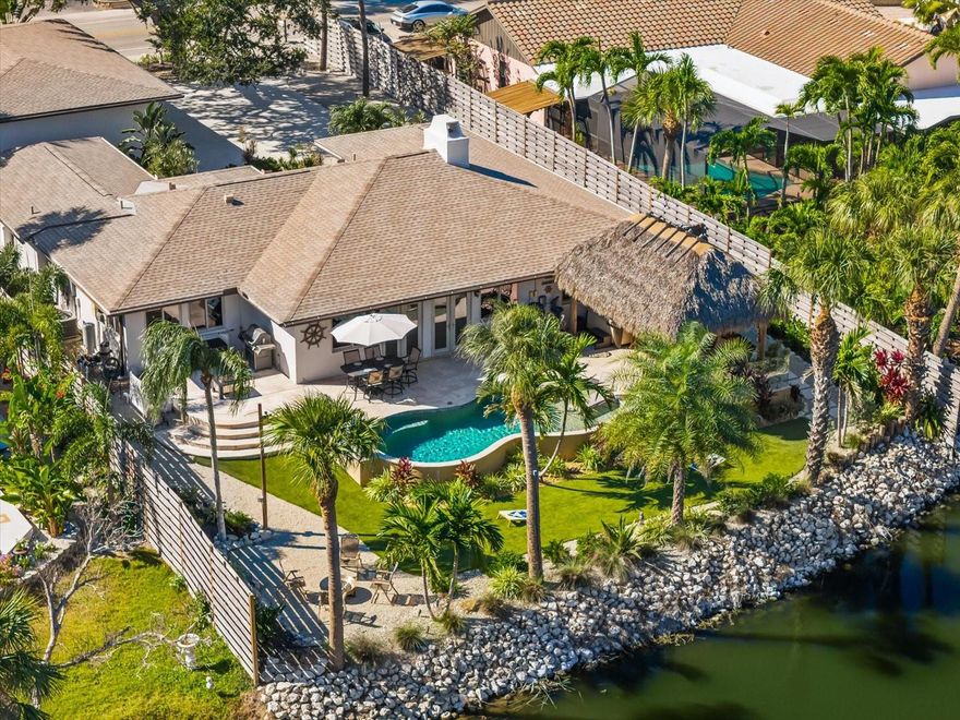 Welcome to 4817 Ocean Blvd – Your Private Lakefront Escape in the Heart of
Siesta Key
Set on a tranquil spring-fed lake just moments from Siesta Beach and the Village, this
flood resilient and meticulously maintained coastal residence offers year-round
enjoyment or the perfect lock-and-leave retreat. Elevated and thoughtfully updated, it
blends timeless coastal style with exceptional quality and peace of mind.
Inside, an open layout showcases engineered oak hardwood floors, solid maple
cabinetry, Santorini quartzite countertops, and Thermador appliances. The
primary suite features serene lake views and a spa-inspired bath wrapped in
Calacatta Oro tile.
Outdoors, enjoy a heated saltwater pool, Hot Springs spa, and Tiki Hut with lighting,
TV, and sound — perfect for entertaining. The maintenance-free backyard, astro turf
lawn, and SWAT mosquito misting system ensure comfort and convenience year-
round.
A true standout, the air-conditioned 5-car garage with lifts, compressor, and 200mph-
rated doors is a car enthusiast’s dream.
With a 2019 roof, impact windows and doors, natural gas utilities, and smart home
features, this home delivers effortless coastal luxury.
Whether as a full-time residence or a seasonal escape, 4817 Ocean Blvd delivers a
lifestyle that is uniquely Siesta Key — coastal elegance, lakefront tranquility, superior
craftsmanship, and the freedom to simply lock, leave, and enjoy.