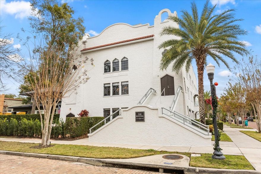 Just one block from Lake Eola Park in the heart of Downtown Orlando, this one-of-a-kind residence offers the rare opportunity to own a true piece of the city’s history. Originally built as a mission-style church in 1928, the building has been thoughtfully reimagined into a limited collection of five architecturally distinct townhomes known as The Revival.
This end-unit home stands apart, with a dramatic exterior staircase leading to the original church doors, serving as a striking architectural reminder of the building’s past. Blending historic character with contemporary design in a way that feels both intentional and timeless. A private elevator connects all 4 levels of the residence, setting the tone for how seamlessly and thoughtfully the home lives from the moment you arrive.
Original architectural elements—exposed brick, soaring cathedral ceilings, warm wood beams, and antique pointed steel-cased windows—tell the story of the building’s past, while designer finishes, curated lighting, and modern upgrades elevate the space for today’s lifestyle. The result is layered, refined, and unlike anything else in Downtown Orlando.
The first level welcomes you with a charming entry and mudroom, along with direct access to a private backyard patio. This level also includes a flexible bedroom suite, ideal for guests or a private office, complete with its own en-suite bath and separate entrance.
On the second floor, two additional en-suite bedrooms provide comfort and privacy, including a spacious primary suite featuring a beautifully appointed bath, generous counter space, and a walk-in closet with custom built-ins.
The third floor anchors the home with an open-concept kitchen, featuring a substantial island with breakfast bar, seamlessly blending into the dining and living areas for effortless entertaining. A dramatic spiral staircase leads to a lofted overlook, perfect for a home office or second living area, with stairs up to a wet bar with access to the rooftop terrace, where panoramic Downtown Orlando skyline views create a truly unforgettable backdrop.
From morning light streaming through historic windows to evenings spent watching Lake Eola’s fireworks from above the city, this is a home meant to be experienced—not just seen. Unforgettable sunsets, glowing city lights, and seasonal celebrations become part of everyday life here.
Additional features include a large laundry room with ample storage, and a tandem two-car garage.
This residence offers walkable access to dining, shopping, entertainment and cultural destinations—while delivering a living experience that is truly rare. This is not simply a home, but a thoughtfully reimagined piece of Orlando history. Come experience it for yourself. You won’t be disappointed!
