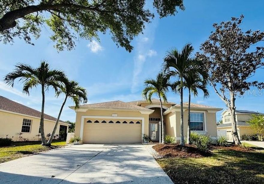 UNFURNISHED. AVAILABLE APRIL 7, 2026 FOR SALE Or RENT. Stunning open floor plan with soaring 15-foot vaulted ceilings that will impress you the moment you enter this beautiful home. Elegant 24-inch tile flows throughout the main living areas and kitchen, enhanced with decorative stone inlays. A breathtaking natural stone, wood-burning fireplace creates a warm and inviting focal point in the main living dining area. Recessed lighting throughout enhances the spacious, open-concept design. The thoughtfully designed floor plan features a large kitchen with built-in desk area perfect for homework and parents working from home. Elegant stainless steel appliances, gas stove, pullout cabinet drawers, bi-fold door pantry and separate laundry room complete with 42" cabinetry, storage closet, oversized LG washer and dryer with quieting pocket door. The kitchen and formal living room seamlessly flow into the family room—perfect for everyday living and entertaining. Crown molding throughout the home adds an elegant finishing touch. The large primary suite features walk-in closets, dual vanities, a relaxing garden tub, and a glass-enclosed shower. The interior and exterior have been freshly painted, and the family room has newer carpet making this home truly move-in ready. Disappearing glass sliding doors open to a beautifully paved, enclosed lanai complete with a built-in gas grill—perfect for entertaining. The expansive 31x14 pool offers full sun exposure and is thoughtfully designed with a bench seat and massaging jets for ultimate relaxation. The outdoor space offers a relaxed, beach-inspired atmosphere with a sand feature that creates a coastal vibe. The fully fenced yard is surrounded by privacy shrubs and palm trees, providing a serene setting. An additional 20x35 ft fenced side yard offers plenty of space for family fun, pets, or outdoor activities. The home is situated on a quiet cul-de-sac within a small, friendly, family-oriented community where neighbors truly enjoy living. Enjoy the convenience of walking or riding bikes to Tara Elementary and close to the iconic Linger Lodge for live entertainment, dining, canoeing, and fishing. Just minutes to the interstate and UTC shopping, and approximately 30 minutes to the beautiful Gulf beaches including Anna Maria Island, Manatee Beach, Cortez Beach, Holmes Beach, Siesta Key, and Lido Beach. Prime location with everything you need at your fingertips. LOW HOA, NO CDD, and a charming, close-knit community make this an exceptional opportunity.