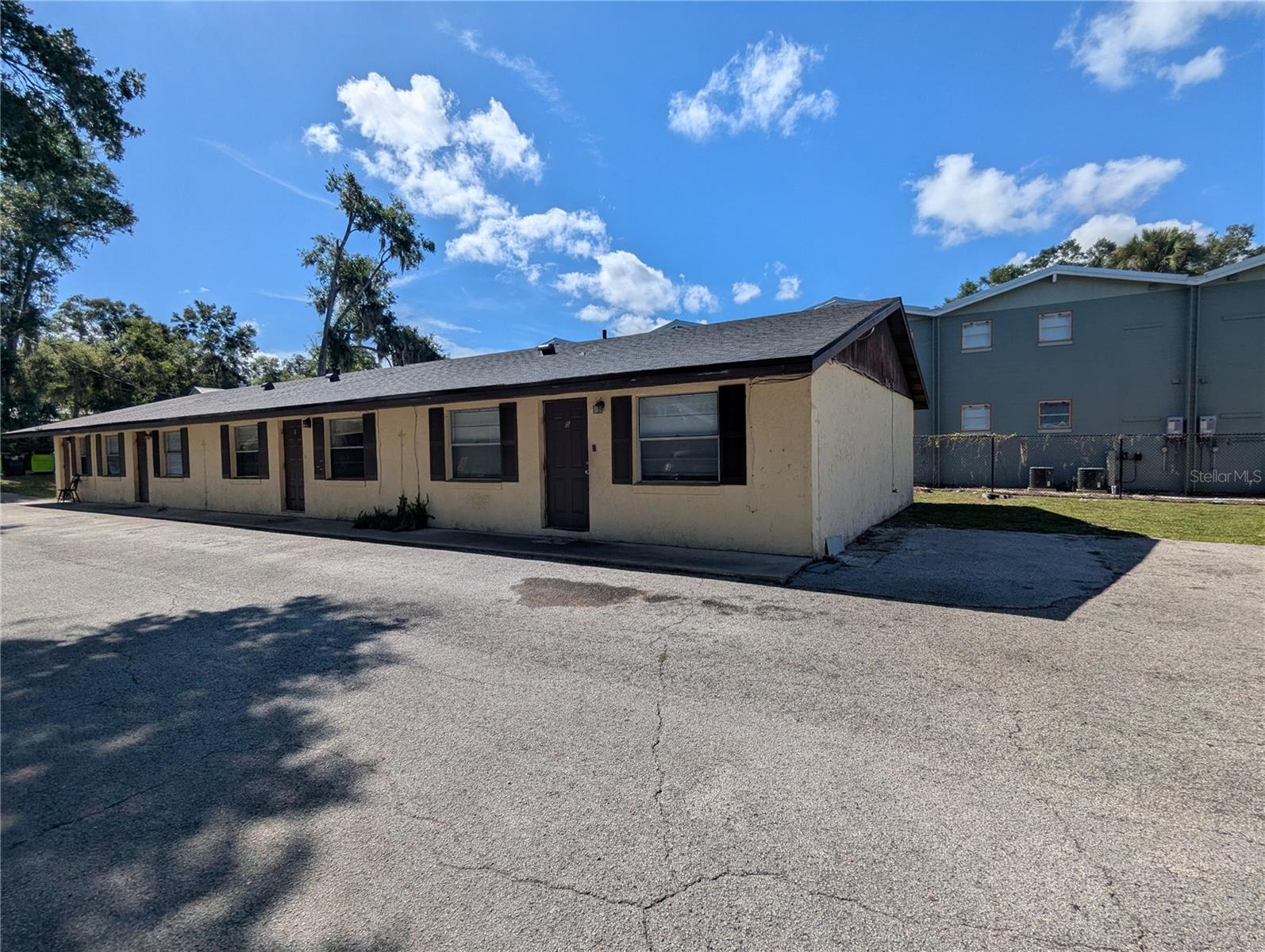 This 8-unit apartment complex offers strong rental potential just steps from Stetson University. The property consists of two concrete block buildings, each with four units. The mix includes: Two efficiency units with window A/C, Two spacious 2 bed / 2 bath units, Four 2 bed / 1 bath units. Recent upgrades include new roofs on both buildings. Utilities feature one shared water meter and separate electric meters for each unit. Whether you’re expanding your portfolio or seeking a steady income stream in a high-demand rental area, this property checks all the boxes.