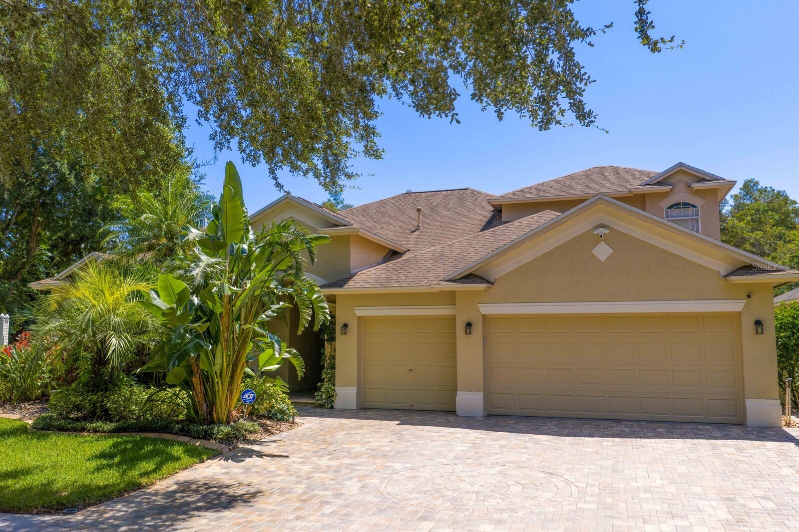 Welcome to this 5 BR/4 Bath+ Office, 3-car garage, two-story home, with screened Pool on Pond and Conservation, all perfectly located on a dead-end street, in the Steinbrenner School District. Enter from your paver driveway and front entry, through the glass double-front door, where you and your guests will be welcomed to an amazing view of the pool and lush landscaping in the backyard. Owner’s Suite is on the main floor with hardwood floors, double vanity, separate water-closet, large walk-in shower, tub, walk-in closets and a door out to the lanai. All adjacent to a designated workspace with wood floors and built-in shelving, makes for an easy ‘commute’. Living Room with sliding doors out to the lanai and pool, and Dining Room, to enjoy entertaining, complete the front space. Move along to the Large Open Kitchen with 2- built-in ovens, cooktop, microwave, side-by-side fridge/freezer, and dishwasher, and walk-in-pantry, to complete the chef’s wish list. All this alongside a Breakfast Nook and Family Room with more views of the lush backyard landscaping. Stroll out the sliding glass doors to your paver, screened pool with ‘beach-entry’, updated finishes, and the piece de resistance, the outdoor kitchen, with its new grill, and sink, plus an outdoor shower! Bedroom 2, with en-suite/pool bath completes this area. Now, come in near the garage, and you’ll find a walk-through designated laundry space, with a storage closet, next Bedroom 3 with a ‘Murphy Bed’, Bathroom, and Bedroom 4. Walk-up he newly carpeted stairs, up to the 5th Bedroom with full-bath; perfect ’get-away’ for dad, gaming or as a Guest Suite. Roof replaced (2017), Pool updated (2018), new pool & spa heater (2018)/ A/C system replaced (2021), Pump/filter (2023) re-painted interior (2025), New Carpet (2025),). Outdoor "Tikki" bar is pre-plumbed with electric and water, under roof in lanai. Electric Car Plug in garage. Located just 5 minutes from Steinbrenner High School and within minutes to the Veteran’s Expressway, this home offers the perfect blend of convenience and leisure. One or more photos have been virtually staged.