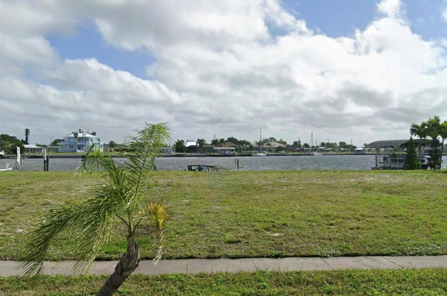 Waterfront lot with desirable southeast rear exposure, offering beautiful sunrise views over the canal. Approximately 80 feet of water frontage, ideal for boating and outdoor living. Generous lot size provides ample space to design and build your custom home. Peaceful setting with great natural light throughout the day. Located in a well-established area of Port Charlotte. Perfect opportunity to create your dream home in a prime waterfront location. Call Listing Agent for more information.