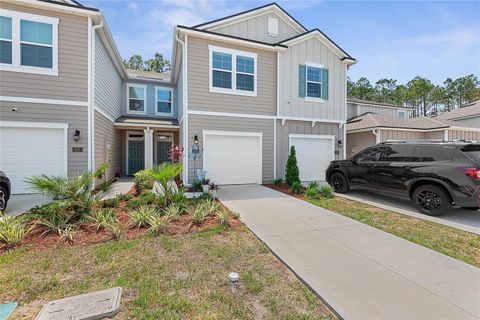 Photo of 309 Redbud Road, Palm Coast, FL 32137 (MLS # FC309439)