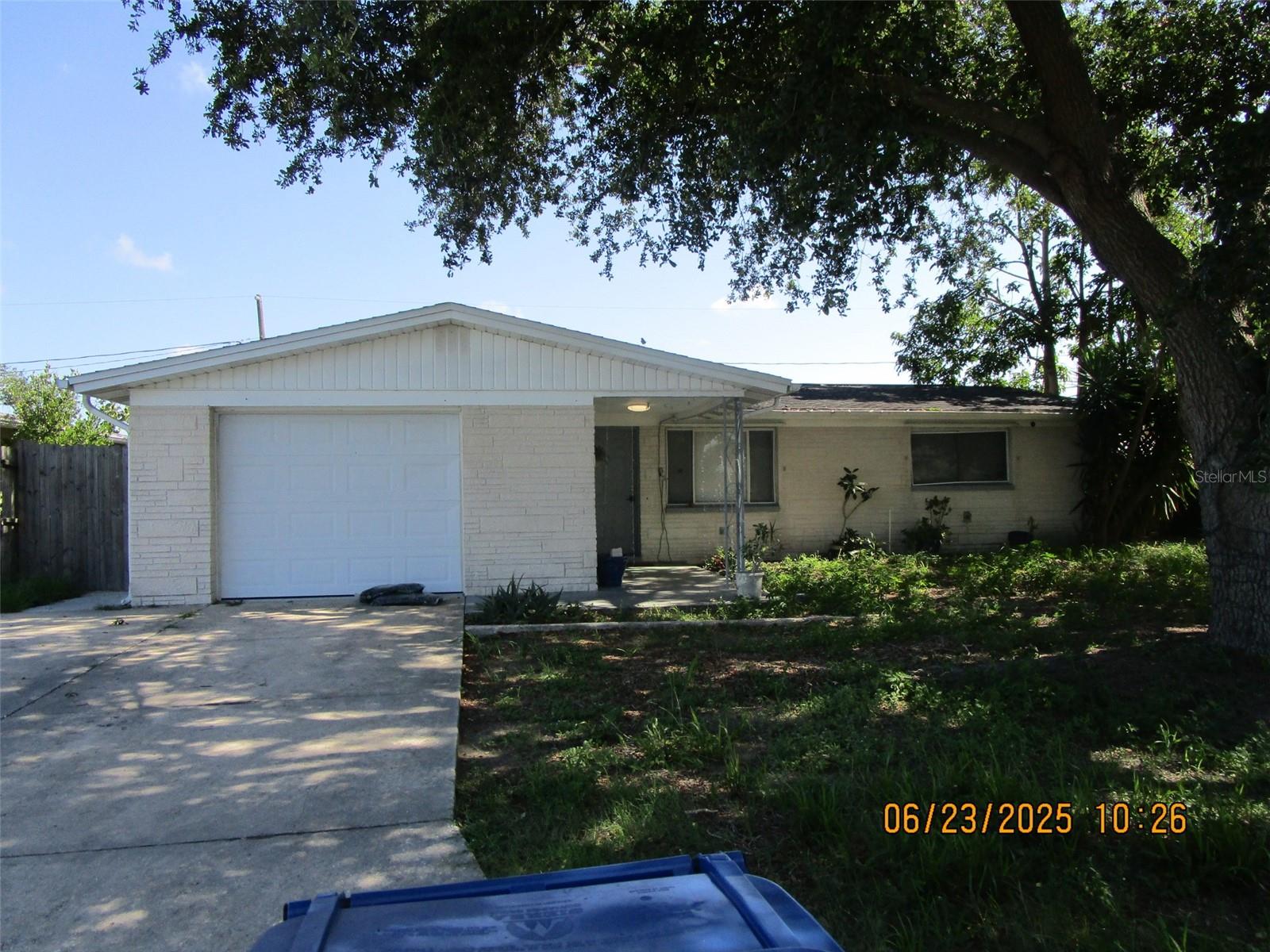 Welcome to this charming 2-bedroom, 1.5 bath home with a bonus room, perfect as a third bedroom, office, or cozy den. Conviently located in Tahitian Homes of Holiday. The bonus room opens directly to the backyard, offering easy indoor-outdoor living. You'll love the large, fenced yard. The half bath is conveniently located in the garage. Don't miss the opportunity to make this versatile and inviting space your next home! Pet friendly!