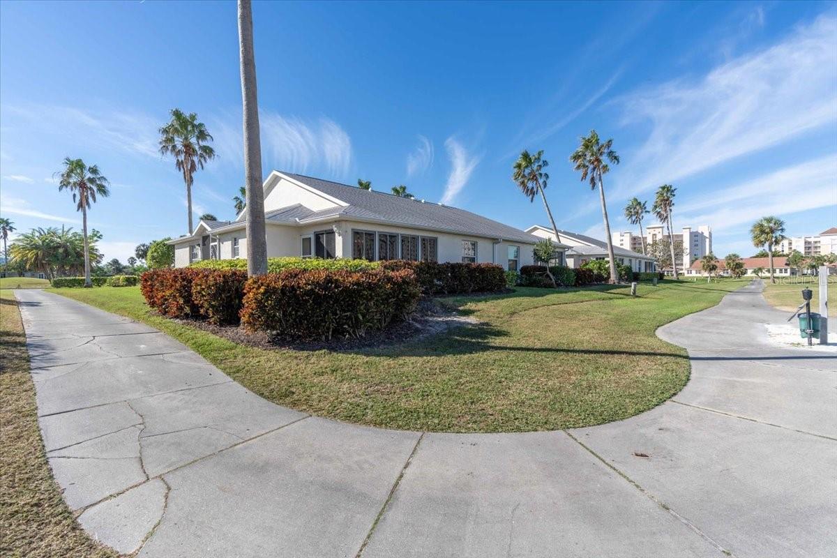 Welcome to this updated end unit Villa in the desirable community of Terra Ceia Golf and Country Club that has just had a dramatic price reduction! This home sited on the 8th tee with beautiful water and golf course views features three bedrooms with generous closet space, two updated baths, a modern kitchen with ample cabinetry, updated appliances, granite counters and a counter height bar for dining. An enclosed private lanai overlooking the 8th tee and fairway provides the perfect spot to relax and sip a beverage or simply curl up with a good book. A split floor plan with a generous open concept great room makes this the ideal home to soak in the Florida lifestyle. A generous two car private attached garage with a work bench and loads of shelving for storage allows for plenty of room for a golf cart, your clubs or even fishing equipment. This Community offers its residents a fishing pier and walking paths through the mangroves on Terra Ceia Bay with views of the Sunshine Skyway Bridge as a backdrop. A fully maintained heated community pool is included with your maintenance. Terra Ceia Golf and Country Club offers both Social and Golf Memberships although joining is optional to the 18 hole, par 62 executive course with dining and events. This community is located conveniently between Sarasota and St. Pete with easy access to the beautiful beaches of the Gulf Coast, shopping and dining in Lakewood Ranch and University Town Center and within minutes to the Marina at Safe Harbor Regatta Pointe. Schedule your appointment to see all that this community offers today!