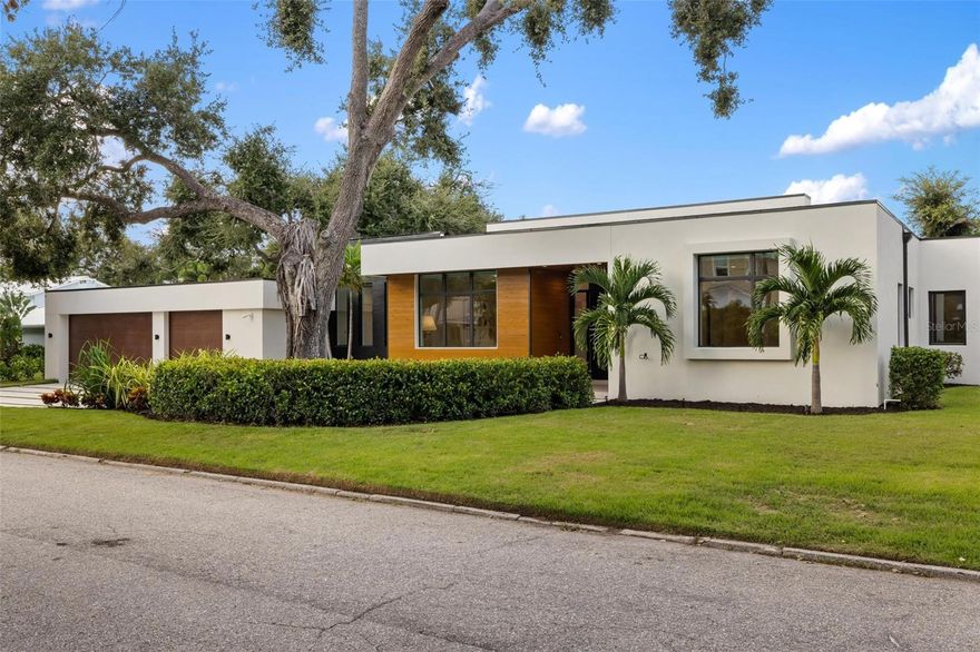 Introducing a rare opportunity in Poinsettia Park II, one of the most desirable enclaves within Sarasota’s coveted West of Trail community. Built in 2023 by Voigt Brothers, this single-level custom residence offers 4,550 square feet of elevated living on an oversized .38-acre lot, where timeless design meets modern innovation. From the moment you enter, soaring ceilings and a flawless Stage 5 drywall finish set the tone for elevated craftsmanship and intentional design. At the heart of the home, a bright and expansive open-concept living area is anchored by a chef’s kitchen featuring Bosch refrigerator and freezer towers, a gas range with pot filler, electronic upper cabinetry, and a striking leather-finished quartzite island. The primary suite offers a private retreat with two spacious walk-in closets, an oversized soaking tub, custom indoor shower, outdoor shower, and a tranquil courtyard. Four additional bedrooms—including a distinctive guest wing with wet bar, wine cooler, and lounge area—provide both flexibility and privacy for residents and guests alike. Luxury finishes continue throughout, including 8-ft solid core doors, custom closet systems, and an electric fireplace in both the living room and primary suite. Smart home technology integrates seamlessly with electronic window treatments, audio and lighting controls, and a whole-home security system. Designed for indoor-outdoor living, the great room opens to a resort-style backyard featuring a covered entertaining area, Blaze outdoor kitchen with gas grill, saltwater heated pool, and two outdoor showers—all wrapped in privacy fencing and enhanced by architectural hardscaping and a full irrigation system. Ideally located near top-rated Southside Elementary, Sarasota Memorial Hospital, and the boutique shopping and dining of Southside Village and downtown Sarasota, with world-renowned Siesta Key, Lido Key, and St. Armands Circle just minutes away. This is more than a residence—it's a Sarasota lifestyle statement.