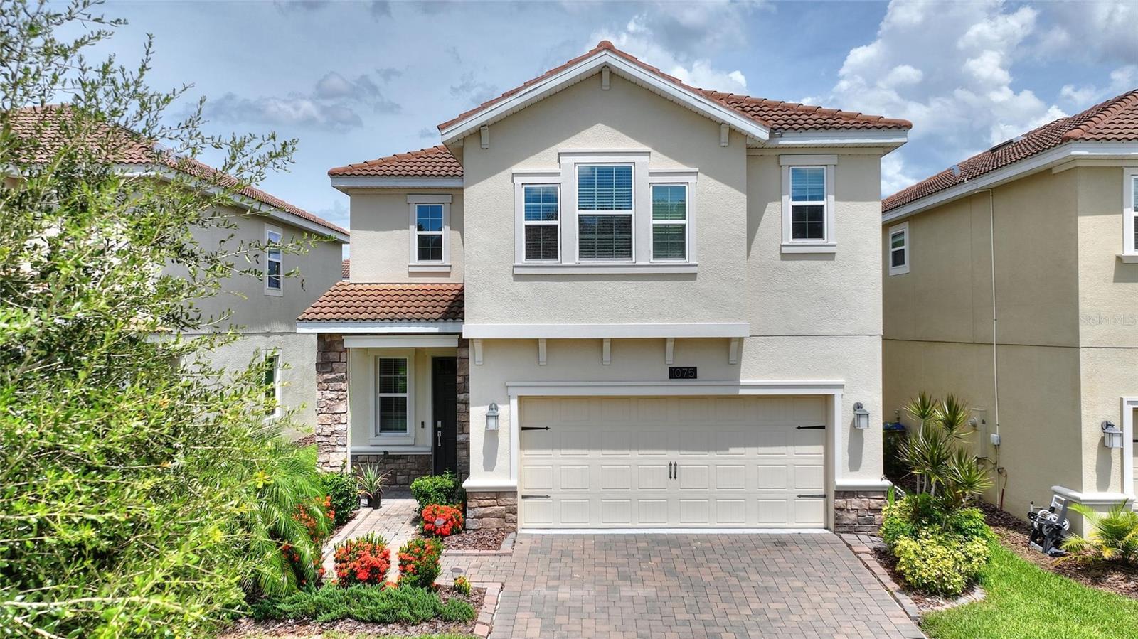 LIVE LIKE A CHAMPION! FULL GOLF MEMBERSHIP INCLUDED IN HOA! Perfectly positioned just steps from the residents-only North Pool and neighborhood park, this immaculate 4-bedroom, 2.5-bathroom home in the highly sought-after ChampionsGate Country Club offers over 2,300 square feet of thoughtfully designed living space. Enjoy serene pond views from your extended screened lanai, creating the perfect backdrop for morning coffee, evening relaxation, or entertaining guests. Inside, the gourmet kitchen showcases stainless steel appliances, quartz countertops, 42” upper cabinets, and a spacious center island, ideal for both everyday living and hosting gatherings. The luxurious primary suite features a walk-in closet, dual vanities, a soaking tub, and a tiled walk-in shower. Living in ChampionsGate means resort-style amenities at your fingertips. As a resident, you’ll have access to the Oasis Club, a 14,000 sq. ft. clubhouse offering a restaurant, movie theater, fitness center, game room, tiki bar, lazy river, cabanas, and more. You’ll also enjoy entry to The Plaza, an exclusive residents-only clubhouse with another restaurant, bar, fitness center, game room, and pool. And for even more fun, the Retreat Club features a full waterpark and outdoor bar & grill. The HOA includes full golf and tennis membership, gated security, all clubhouse access, complete lawn care, cable, internet, phone, trash, and security monitoring—offering a true maintenance-free lifestyle. The CDD is included in the property taxes for added convenience. Ideally located near world-renowned attractions, shopping, dining, and entertainment, this home blends luxury, location, and lifestyle in one exceptional offering.