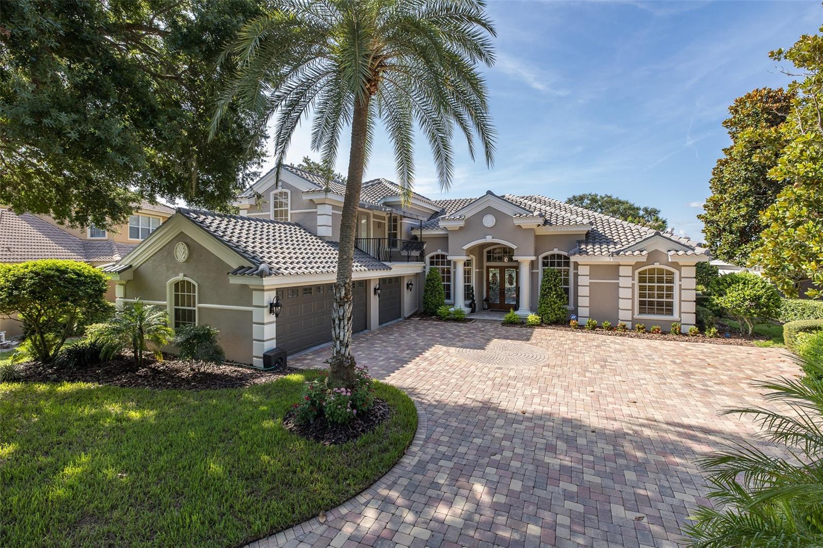 Luxury Champions Club custom built Costanza home perfectly situated on the 11th Tee of the Fox Hollow Golf Course! Waterfront & Golf Course Views! This upgraded home is tucked behind the coveted gates of Floresta in the Private, Gated Golf Course community of Champions Club just steps from the Fox Hollow Club House & Community Clubhouse! This lovingly maintained home greets you with an expansive pavered driveway & lush newer landscaping! Double leaded front doors welcome you into the OPEN Floor Plan! The formal living room & dining rooms are light and bright and the formal living room features a gorgeous coffered ceiling and atrium doors that offer views of pool & lush golf course. The kitchen is a chef's delight & is equipped with all new appliances, custom gas cook-top, elegant wood cabinetry & NEW Cambria Quartz countertops! The family room features a cozy fireplace & many windows with the perfect backdrop offering views of the gorgeous golf course & sparkling ponds! The owner's retreat is located on the first floor & features a sitting area with beautiful views & his/her custom closets complete with organizers. The en suite bath is pampering and boasts new relaxing garden tub, large walk-in shower & his/her wood vanities with NEW Cambria Quartz counters. An office/den space is located in the front of the home just steps from the owner's suite. A spacious guest room with adjacent bathroom, spacious laundry room & pool bathroom complete the first floor. Upstairs you will find a generous bonus room ~ perfect space for a media room or second family room which also features a private balcony! A roomy loft space, currently being used as a home gym is a great multi-purpose extra space. Two secondary bedrooms are located on the 2nd floor & full bathroom. Step onto your private screened lanai & enjoy room in the sun or shade. Relax in the sparkling salt-water pool which features a NEW gas heater or enjoy the summer kitchen. This amazing home is located on one of the MOST PREMIUM lots in all of Champions Club and spans over 1/3 acre while taking in views of the picturesque golf course & relaxing water views! This home offers MANY recent UPGRADES: BRAND NEW TILE ROOF (2024), NEW hardwood flooring on the first floor (2023), 2 NEW TRANE HVACs (11-2018), NEW Cambria Quartz Counters in all baths & kitchen (2018), ALL NEW appliances (2018), NEW water heater (2023), NEW gas pool heater (2018), All NEW interior/exterior Paint (2025), NEW landscaping (2025), NEW motorized blinds (2020), NEW garage door openers (2023) & SO MUCH MORE! Champions Club is a private gated community featuring a private clubhouse, Resort-style pool & spa, Fitness Center, Tennis, Pickle ball, Basketball & many planned activities for all ages throughout the year. Zoned for A+ rated schools, Trinity Elementary, Seven Springs Middle & J.W. Mitchell High. Conveniently located close to many shops, restaurants, medical facilities, SunCoast Pkwy & short drive to many local beaches, Tampa International Airport & St. Pete/Clearwater Airport! One of Tampa Bay's Premier Communities with so much to offer its residents!