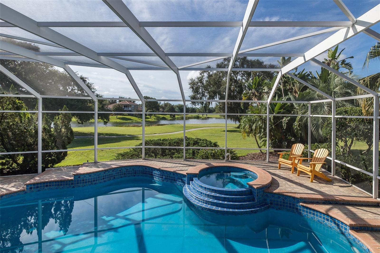 ** 50K PRICE ADJUSTMENT ~ AMAZING VALUE & BREATHTAKING VIEWS ** Luxury Champions Club custom built Costanza home perfectly situated on the 11th Tee of the Fox Hollow Golf Course! WATERFRONT & GOLF COURSE VIEWS! This upgraded home is tucked behind the coveted gates of Floresta in the Private, Gated Golf Course community of Champions Club just steps from the Fox Hollow Club House & Community Clubhouse! This lovingly maintained home greets you with an expansive pavered driveway & lush newer landscaping! Double leaded front doors welcome you into the OPEN Floor Plan! The formal living room & dining rooms are light and bright and the formal living room features a gorgeous coffered ceiling and atrium doors that offer views of pool & lush golf course. The kitchen is a chef's delight & is equipped with all new appliances, custom gas cook-top, elegant wood cabinetry & NEW Cambria Quartz countertops! The family room features a cozy fireplace & many windows with the perfect backdrop offering views of the gorgeous golf course & sparkling ponds! The owner's retreat is located on the first floor & features a sitting area with beautiful views & his/her custom closets complete with organizers. The en suite bath is pampering and boasts new relaxing garden tub, large walk-in shower & his/her wood vanities with NEW Cambria Quartz counters. An office/den space (or 5th bedroom) is located in the front of the home just steps from the owner's suite. A spacious guest room with adjacent bathroom (perfect in-law suite), spacious laundry room & pool bathroom complete the first floor. Upstairs you will find a generous bonus room ~ perfect space for a media room or second family room which also features a private balcony! A roomy loft space, currently being used as a home gym is a great multi-purpose extra space. Two secondary bedrooms are located on the 2nd floor & full bathroom. Step onto your private screened lanai & enjoy room in the sun or shade. Relax in the sparkling salt-water pool which features a NEW gas heater or enjoy the summer kitchen. This amazing home is located on one of the MOST PREMIUM lots in all of Champions Club and spans over 1/3 acre while taking in views of the picturesque golf course & relaxing water views! This home offers MANY recent UPGRADES: BRAND NEW TILE ROOF (2024), NEW hardwood flooring on the first floor (2023), 2 NEW TRANE HVACs (11-2018), NEW Cambria Quartz Counters in all baths & kitchen (2018), ALL NEW appliances (2018), NEW water heater (2023), NEW gas pool heater (2018), All NEW interior/exterior Paint (2025), NEW landscaping (2025), NEW motorized blinds (2020), NEW garage door openers (2023) & SO MUCH MORE! Champions Club is a private gated community featuring a private clubhouse, Resort-style pool & spa, Fitness Center, Tennis, Pickle ball, Basketball & many planned activities for all ages throughout the year. Zoned for A+ rated schools, Trinity Elementary, Seven Springs Middle & J.W. Mitchell High. Conveniently located close to many shops, restaurants, medical facilities, SunCoast Pkwy & short drive to many local beaches, Tampa International Airport & St. Pete/Clearwater Airport! One of Tampa Bay's Premier Communities with so much to offer its residents!