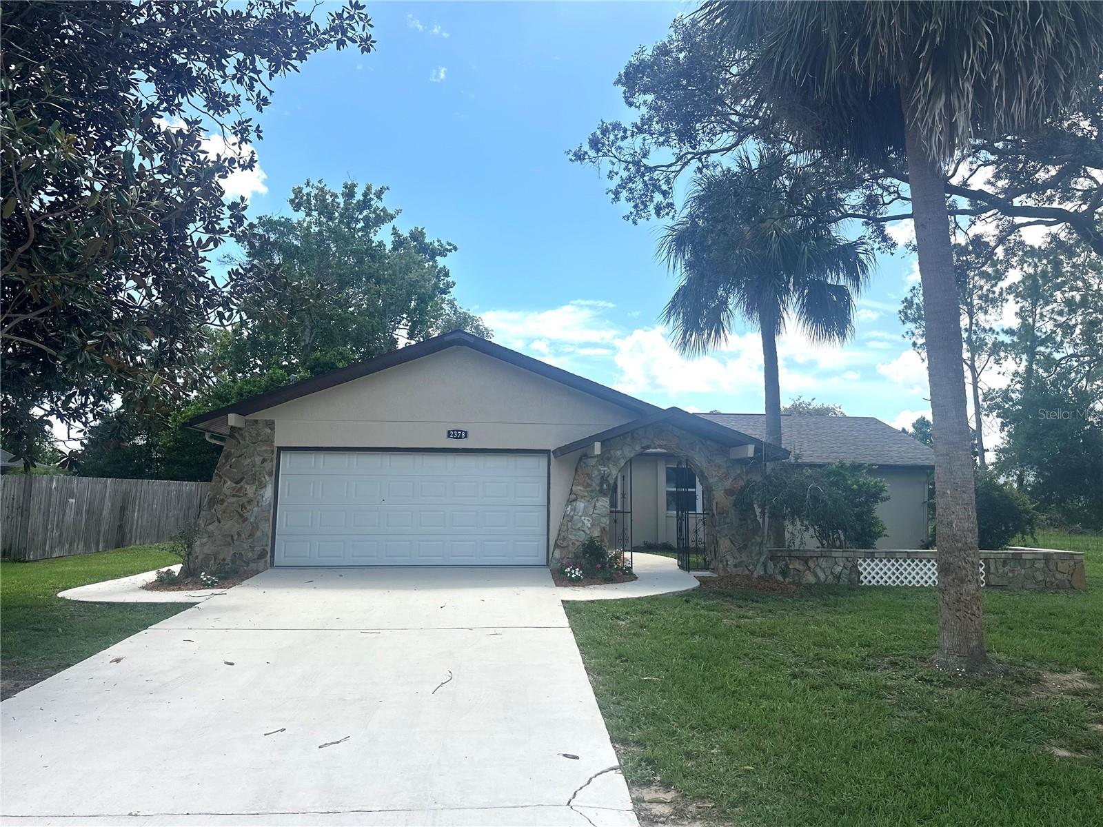 Location, Location, Location! Welcome to this charming 3 bedroom, 2 bath, 2 Car Garage home. Enter through the beautifully landscaped walkway to the front entry and a welcoming floor plan that flows from the light-filled living areas. The spacious master bedroom has a walk-in closet and an en-suite featuring a shower. This split plan has two additional bedrooms with one set up as an in-law suite with a private entrance, a laundry room, and a kitchenette. The fenced backyard is an open canvas with a storage shed. Location is amazing and convenient with easy access to our pristine Nature Coast amenities, Weeki Wachee River for kayaking, Gulf of Mexico for award winning boating, easy commute to Tampa or St. Pete, airports via Suncoast Parkway, all retail stores and restaurants. New interior and Exterior paint, appliances, fixtures, and new carpet. MOVE-IN READY. Bring the family. Call TODAY for a showing. This one will not last long!