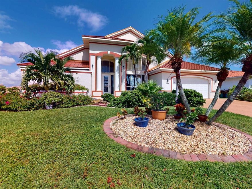 Welcome to 2548 Brazilia Court in Beautiful Punta Gorda Isles.  This extraordinary sailboat home, boasting over 2700 living square feet, encompasses dramatic architectural features while capturing the beauty of wide panoramic views of intersecting waterways. Five minutes from Ponce Inlet, the location is a boater's delight. Enjoy a 50' concrete dock with new pilings and a 10k boat lift so you can cruise Charlotte Harbor or head to the Gulf of Mexico. Soaring 18 ft. ceilings, 8 foot sliding glass doors and transom windows bring the outdoors in with an abundance of natural light. Granite counters in the kitchen and baths, 20" tile floors throughout.  Enjoy a gourmet kitchen with large center island and double ovens (one is convection) and sub zero fridge, great for large parties. Kitchen has had a recent upgrade with soft close doors and drawers along with counters. The eat-in-kitchen with an aquarium glass beveled window overlooks the large  heated pool and brick paved lanai area. The garden master bath offers a clear glass enclosed shower and Jacuzzi tub, double sinks and beautiful granite counter tops. Your guests will love the extra large bedroom suites and guest bath. The Family room which has access to the pool could also be used as a large game room. And to top it all off the Solar panels will keep those electric bills at a minimum for many years to come.