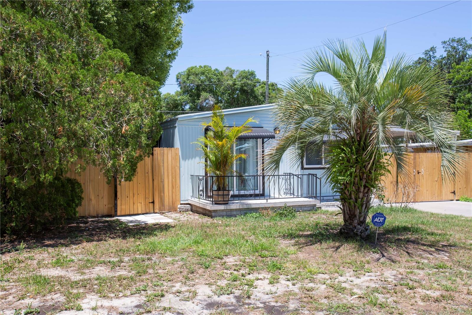 Welcome to this beautifully renovated 2-bedroom, 2-bath double-wide home nestled on a desirable corner lot in Sunshine Park! This move-in ready gem features a spacious open floor plan with brand-new flooring, updated kitchen cabinetry, countertops, and modern appliances. Both bathrooms have been stylishly upgraded, offering a fresh and contemporary feel throughout. Enjoy abundant natural light, generous room sizes, and a seamless indoor-outdoor flow. Outside, you'll find a covered 2-car carport, a large storage shed, and a low-maintenance yard. Located just minutes from shopping, dining, medical facilities, and Gulf Coast beaches, this home offers comfort, convenience, and charm—all in one package. Whether you're looking to downsize, invest, or enjoy Florida living full-time, this one checks all the boxes. No work needed—just bring your things and move right in!