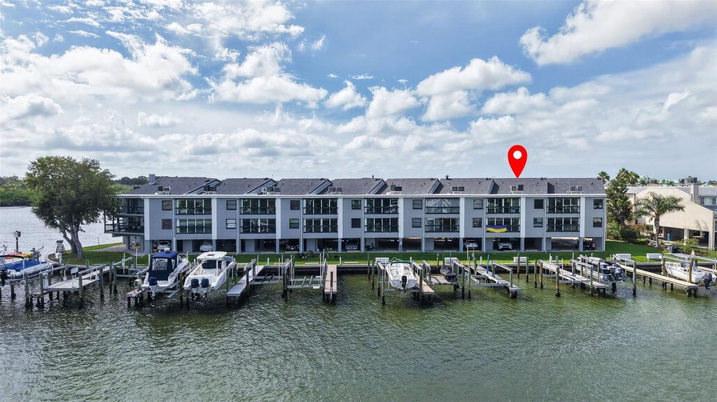 Photo of 326 Windrush Boulevard #202, Indian Rocks Beach, FL 33785 (MLS # TB8549147)