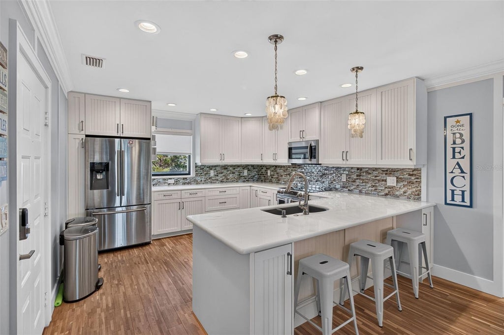 Photo of 326 Windrush Boulevard #202, Indian Rocks Beach, FL 33785 (MLS # TB8549147)