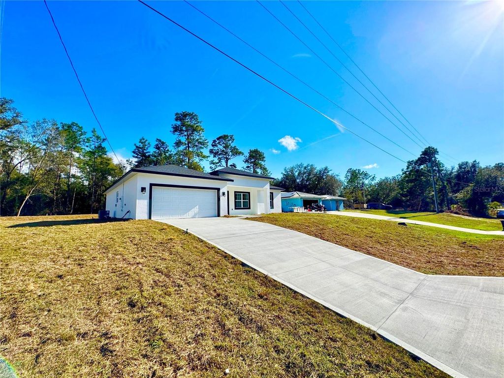Photo of 10375 N Citrus Springs Boulevard, Citrus Springs, FL 34434 (MLS # O6377116)