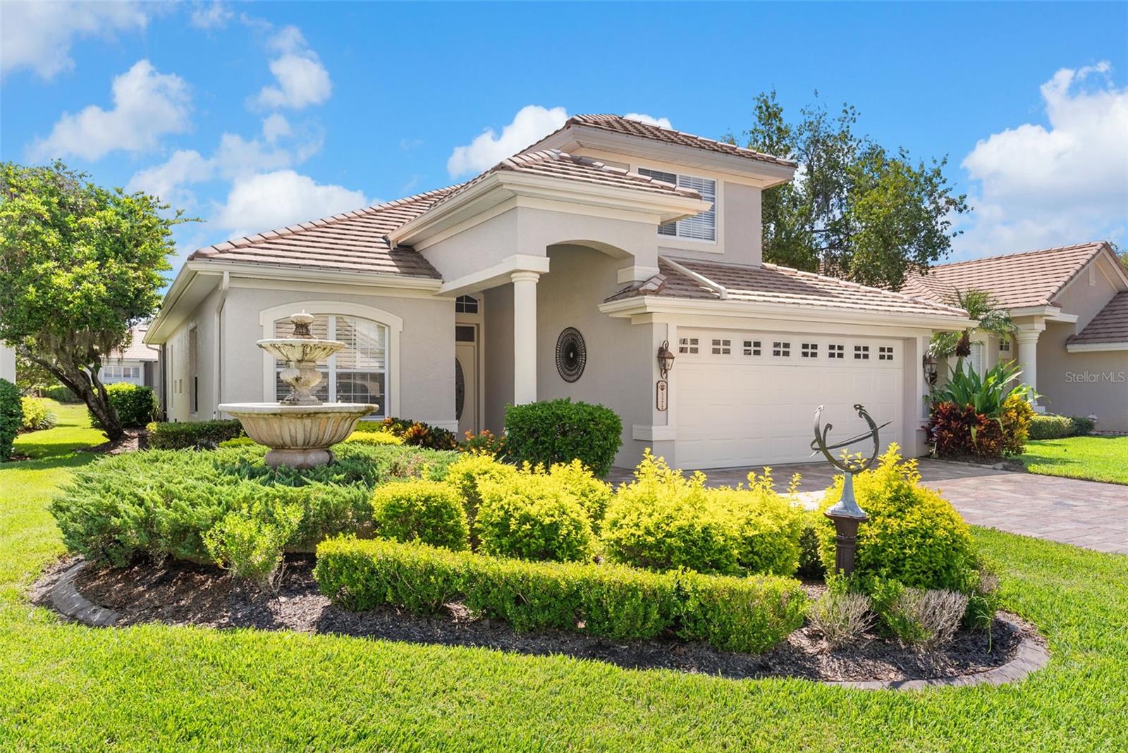 Welcome to this beautiful 3-bedroom, 2.5-bath home with an office/flex room, located in the exclusive Grasslands Golf & Country Club. This beautifully maintained home offers the perfect blend of luxury, comfort, and convenience—all within a serene, maintenance-free, gated community. Step inside to discover a smart and spacious layout featuring formal and casual living spaces, soaring ceilings, crown molding, plantation shutters, and an abundance of natural light. The expansive primary suite on the main floor, boasting two walk-in closets, a bay window with water views, crown molding, and a spa-like ensuite with a Jacuzzi tub, glass-enclosed shower, and dual vanities. Upstairs, two additional bedrooms and a full bath provide space for family or guests, while the flexible bonus room downstairs is perfect as an office, gym, media room, or fourth bedroom. A half bath is located near the laundry room on the main floor for added convenience. Step outside to the private screened lanai overlooking the water, the perfect spot for morning coffee or evening relaxation. Enjoy the perks of maintenance-free living, 24/7 security, and access to a championship golf course. Don't miss your opportunity to live in one of Lakeland’s most sought-after communities!