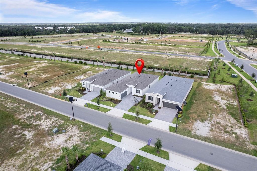 Photo of 563 Hammock Oaks Boulevard, Lady Lake, FL 32159 (MLS # W7880073)