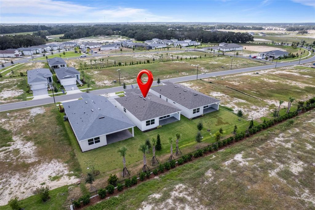 Photo of 563 Hammock Oaks Boulevard, Lady Lake, FL 32159 (MLS # W7880073)