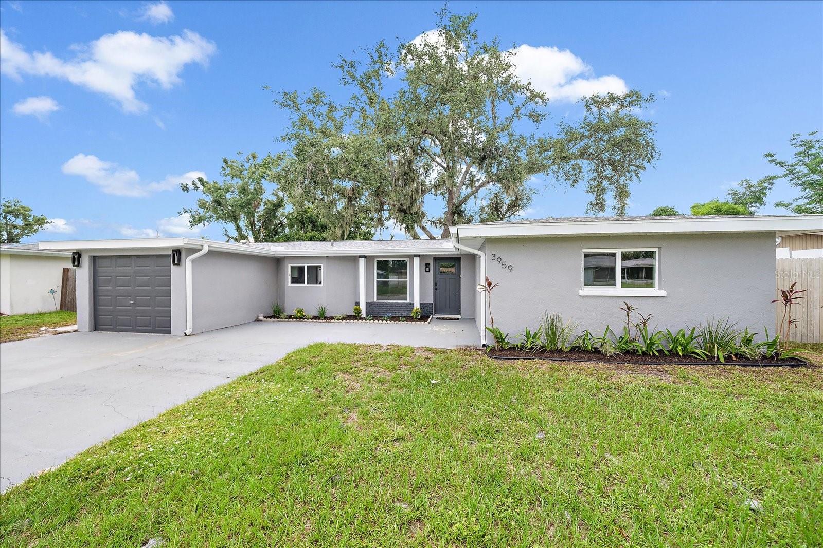 Welcome to this modern, updated 2-bedroom, 2-bath home with a 1-car garage & over-sized driveway located in the desirable Lake Sarasota community. Enjoy the freedom of no HOA and no deed restrictions. The open-concept kitchen is the heart of the home, thoughtfully renovated with crisp white cabinetry that brings a light, fresh atmosphere to the space. Gleaming stainless steel appliances provide both style and reliability, while luxurious quartz countertops add a touch of sophistication and durability. The kitchen’s spacious breakfast bar seamlessly connects with the living and dining areas, creating the perfect setting for casual family mornings or lively gatherings with friends. The living room is highlighted by a stunning stone fireplace that adds warmth & a cozy focal point. The primary bedroom offers a peaceful retreat with ample closet space and natural light. Beautifully Renovated Bathrooms. The primary suite features a luxurious en-suite bath with dual sinks, quartz countertops, and a walk-in pebble stone shower with a sleek rolling glass door. The second bedroom is cozy and versatile. The second bathroom includes a tub/shower combo, quartz vanity, and modern fixtures — perfect for guests or family. The entire home has durable tile flooring throughout — no carpet anywhere! Fresh interior paint and stylish fixtures add to the clean, contemporary feel. Step outside to a fully fenced, spacious backyard — perfect for pets, play, or entertaining. A beautiful mature oak tree provides shade and character, while an additional shed offers extra storage for tools, toys, or hobbies. Ideally situated with seamless access to I-75, Sarasota’s top-rated schools, shopping, dining, scenic parks, and the pristine shores of the Gulf Coast. Whether you're a first-time homebuyer, seasonal snowbird, retiree seeking comfort, or an investor looking for an opportunity, this home is a perfect fit for every lifestyle.