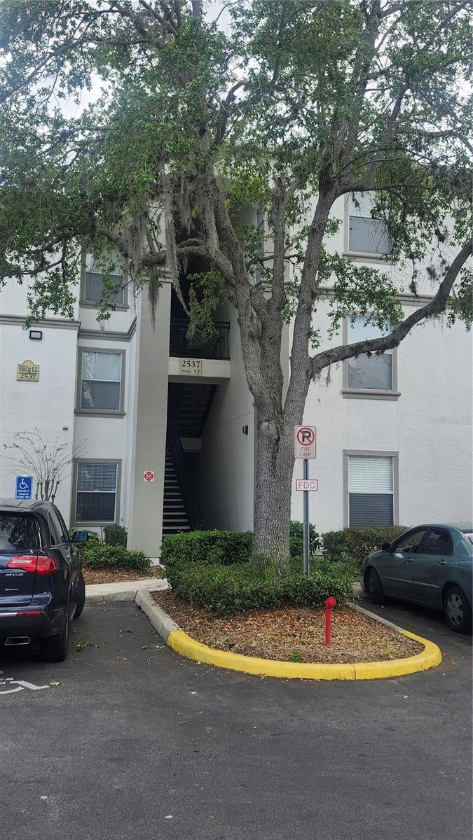 Photo of 2537 Maitland Crossing Way #107, Orlando, FL 32810 (MLS # V4951458)