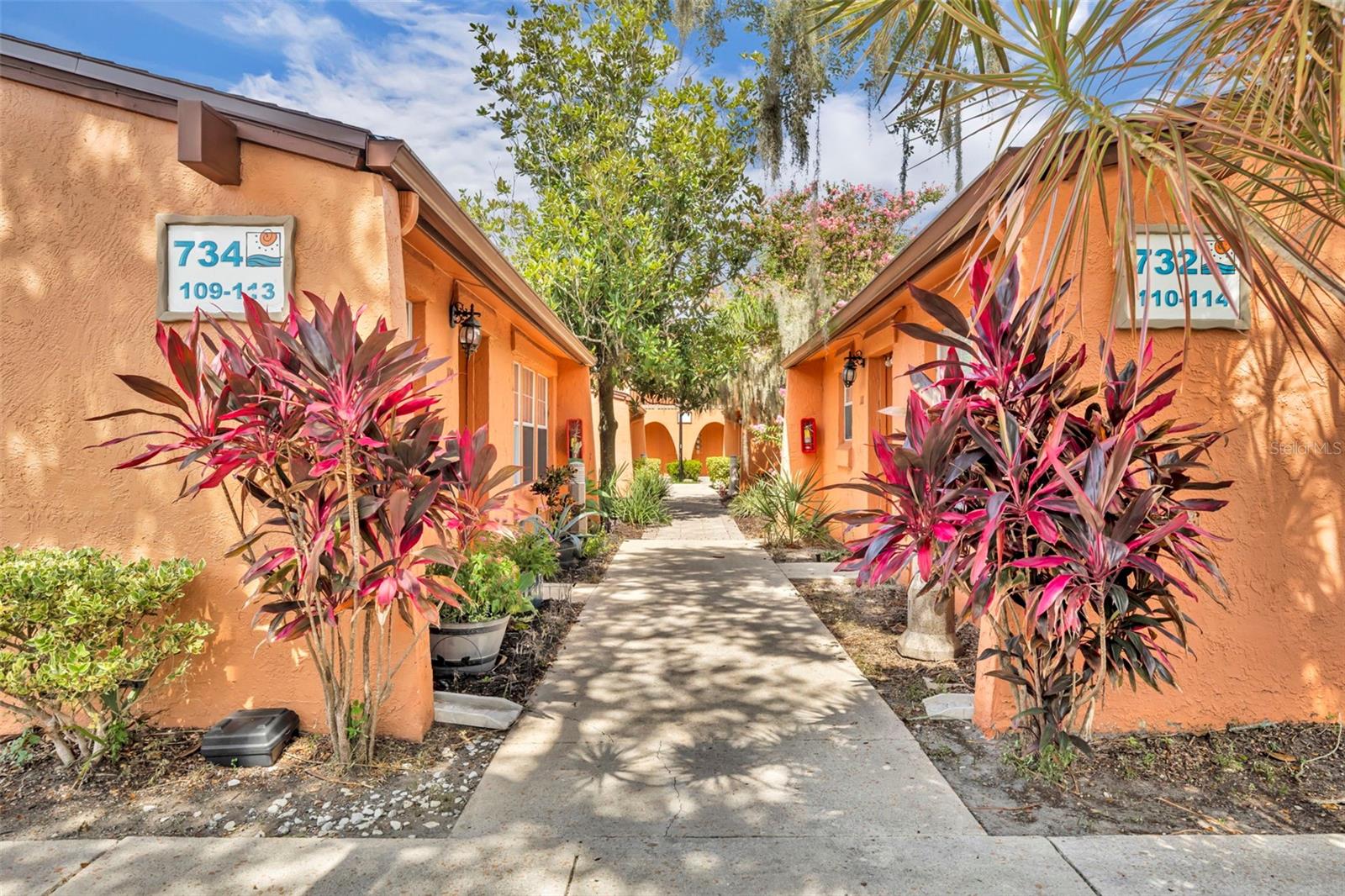 Tucked inside the La Costa Brava Lakeside community, this rare villa-style unit is one of only six with no upstairs or downstairs neighbors. Enjoy a fenced backyard and screened porch with direct access to the community pool and Cantina clubhouse just beyond the gate. Inside, high ceilings with exposed beams add character and volume, and wood-look tile flows throughout for easy maintenance. The open living and dining areas feel airy and inviting, with a built-in wood art piece—complete with twinkle lights—adding warmth and charm to the dining space. The kitchen includes newer appliances, white cabinetry, and a stackable washer and dryer, and offers plenty of potential for future customization. The spacious primary bedroom features an en-suite bath with a large walk-in shower and double closets with built-in systems. The second bedroom is generously sized and adjacent to a renovated hall bath with an extra-deep soaking tub. The community offers two pools, green space, fitness center, and access to Lake Pineloch, where residents enjoy a private boat ramp and spots for kayaking or paddleboarding. All just minutes from Downtown Orlando and surrounded by local favorites like SoDough, Tin & Taco, Ross, and Target—this location truly puts you in the center of it all. Zoned for top rated Blankner K-8 and Boone High Schools. Call today to schedule your private tour!
