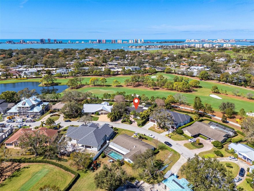 Indulge in the pinnacle of golf course living with panoramic views of fairways, greens, and tee boxes at the prestigious Pelican Golf Club—renowned as an LPGA Tournament Host and celebrated as the finest private golf course in Pinellas County. Located on a street that’s quickly becoming one of the most desirable in Belleair, this home is thoughtfully designed for comfortable living and unforgettable gatherings, seamlessly blending luxury with the vibrant coastal lifestyle of the area.  Step inside to discover an open-concept floor plan featuring three spacious bedrooms and three bathrooms. At the heart of the home, a stylish white kitchen showcases Cambria Quartz countertops, custom cabinetry, and an induction stove that is ideal for everyday cooking. Adjacent to the dining area, a custom bar stands ready for entertaining, complete with a wine refrigerator and beautiful cabinetry to display your finest wines and spirits.  The primary suite is a private retreat, offering an en suite bathroom with a large soaking tub and a generous 11x14 walk-in closet, ensuring comfort and convenience. Venture out back to find a saltwater pool enclosed by a screen, providing a refreshing spot for cooling off in the Florida sun while enjoying scenic golf course views. Elevating your outdoor experience even further, a unique elevated observation deck delivers a stunning vantage point for taking in the lush fairways and spectacular sunsets.  Don’t miss this rare opportunity to make this remarkable residence yours and discover the perfect fusion of luxury and natural beauty that Belleair living provides.