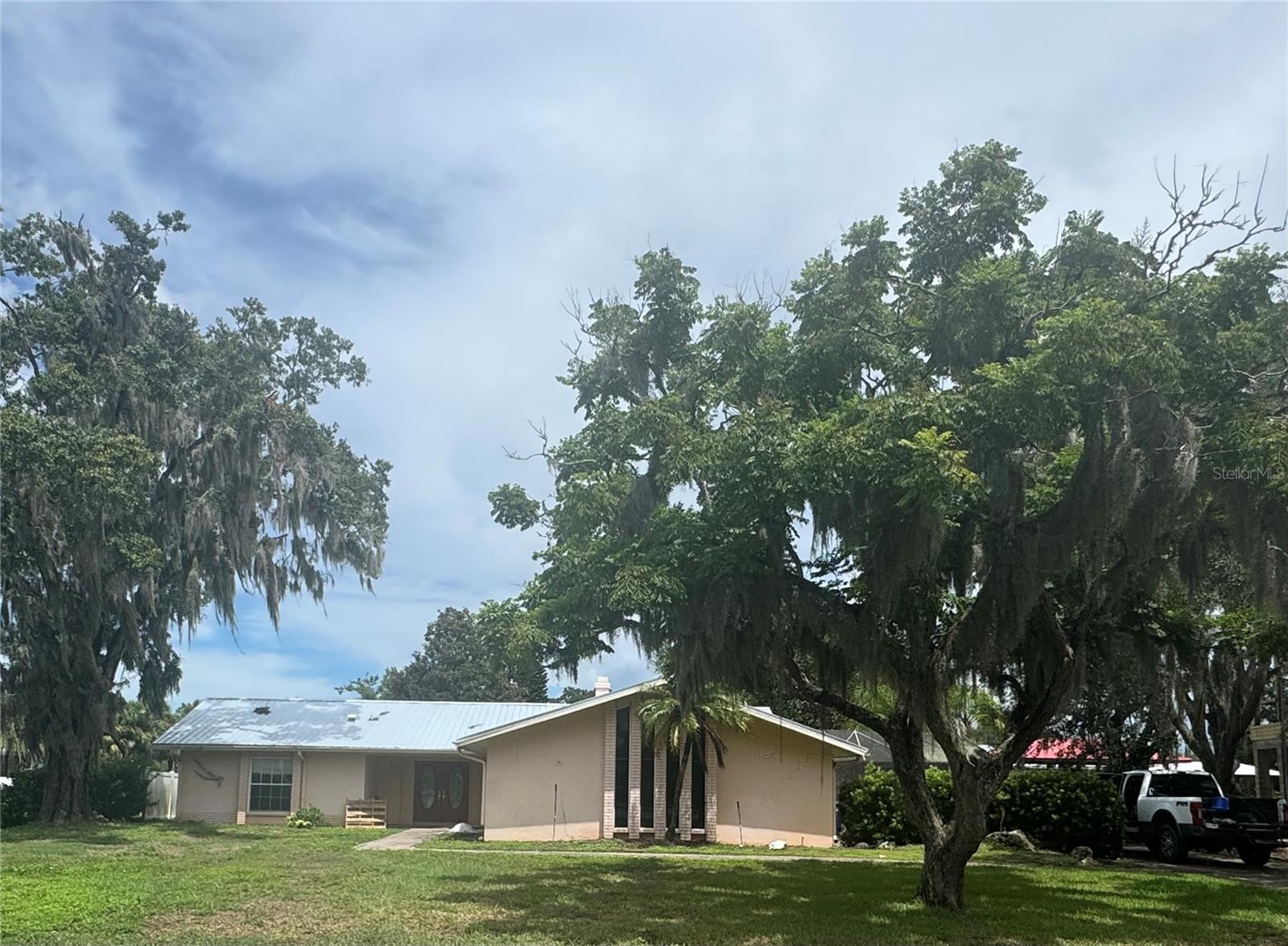 WATERFRONT HOME!!! Located on Kings Bay Dr in downtown Crystal River. Just a short distance to the grocery stores, shops and local restaurants. Home was flooded in 2024 and is currently being remediated. New metal roof, new a/c, new drywall, new kitchen with solid wood cabinets and quartz countertops. Newly remodeled bathrooms, new electrical, new plumbing, new paint inside and out. Open plan kitchen/living room combo with plenty of space for entertaining. Separate dining room could also be used as an office. Notice the beautiful wood tile floors throughout with a stunning view out to the crystal clear freshwater canal. Relax by the pond and enjoy the saltwater swimming pool or lay out and catch the sun on your own private dock. Maybe spot a manatee swimming by! Follow the deep-water canal to King's Bay and kayak with the manatee at Three Sister's Springs or head on out to the Gulf of Mexico the choice is yours. Boat dock has electric lift. Come see what the nature coast living is all about, all the while being just a walk away from your favorite local luxuries and boat marina!!