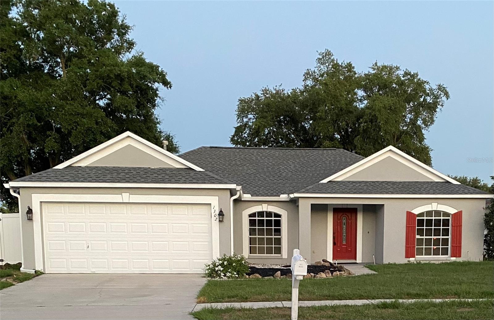 This spacious 4 bedroom, 2 bath residence in the highly desirable Oak Grove community has been thoughtfully updated. Enjoy peace of mind with a new roof (2022), vinyl fence (2024), gas hot water heater (2023), and a newer A/C (2016). The interior (walls, ceilings, doors, baseboards) and exterior have been freshly painted (2025). New floors and windows installed in 2025. The kitchen features granite countertops, tumbled marble backsplash, modern appliances, and lots of storage. The split-bedroom floor plan provides ideal privacy, with the primary suite separated from the other three bedrooms. Indoor laundry room, vaulted ceilings and slider in family room leads to a screened-in lanai. Located in Oak Grove with low HOA, no CDD, and flood insurance is not required.