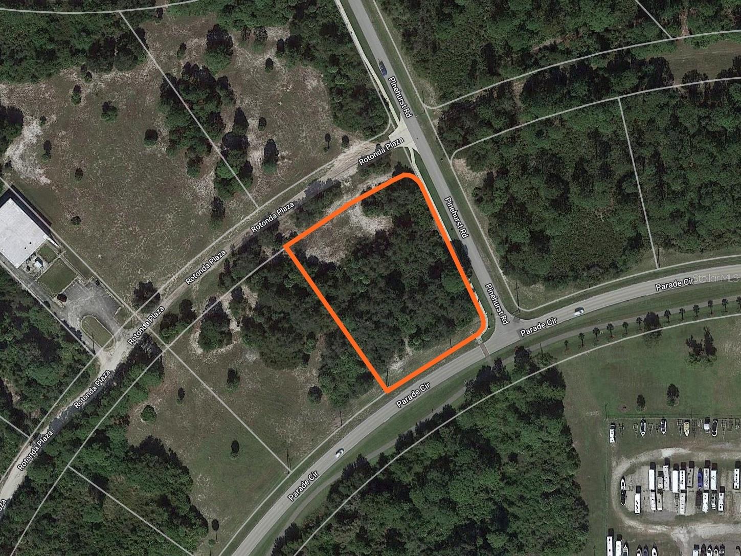 Location, location, location! Look at this beautiful piece of vacant land in the very center of Rotonda West. This lot is favorably zoned OMI which has many commercial uses like Office, Medical, and Institutional as well as residential uses like Multi-Family and Single Family. If you choose to use the conditional zoning option of Multi-Family the density can be up to 10 units per acre. For this 1.59-acre parcel, you could theoretically put 15 units on it. Or you could build one magnificent home on a huge 1.59-acre lot. The choice is yours, commercial or residential. All utilities are here including water, sewer, cable, broadband internet, electricity, and phone. Other lots are available on Parade Circle from the same seller if you would like to purchase several as a package. Seller financing is available.