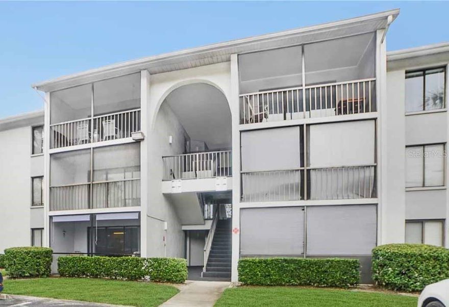 Freshly painted and move-in ready, this charming upper-level condominium is located in the desirable Pine Ridge gated community. The unit offers an open and inviting layout with a spacious living room and dining area featuring beautiful wood-look tile flooring throughout the main living spaces.  The primary suite includes a generous walk-in closet and a private full bathroom with a separate shower area. A spacious second bedroom and additional full bathroom with a tub provide comfort and flexibility for guests, family, or a home office.
Enjoy Florida living from the screened-in patio, perfect for relaxing and taking in the warm weather. Ideally situated near Sanford Airport, shopping, dining, and major roadways including SR-417, US-17, and I-4. This location provides convenient access to Orlando attractions, Disney World, other world-famous theme parks, and is approximately 45 minutes from Daytona Beach.