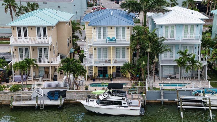 Unrivaled Waterfront Living with Panoramic Bay Views completely updated. Welcome to your dream home, a stunning 3-bedroom, 3-bathroom custom residence where luxury meets convenience on the water. Every detail of this home has been thoughtfully upgraded and meticulously maintained. Step inside through magnificent custom stained-glass front doors and feel the immediate sense of comfort.
Boating enthusiasts will delight in the private dock, capable of accommodating approximately a 30-foot boat, providing direct access to the bay. Enjoy Paddle boarding in your back yard, the bay right behind house, and endless relaxation and entertainment in your heated pool, which can be heated up to 108 degrees! Larger filtration pump has been added so water in jets come out like a Jacuzzi! Can be enjoyed all year long.
Spread out and entertain with ease, featuring a spacious bonus room on the first floor, (about 800 square feet not included in square footage of the house), – an incredibly versatile space ideal for a fourth bedroom, Mother-in-Law suite, state-of-the-art home gym, game room, or anything your heart desires. Comfort is paramount with two-zone AC systems and an on-demand tankless hot water system, and city gas for stove, and pool heater. This property is also equipped with a sprinkler system thru out the home for your safety, and your own private elevator. Ascend to the upper levels to discover not one, but two private balconies offering absolutely fabulous, unobstructed views of the bay. Imagine sipping your morning coffee or unwinding with a sunset cocktail as the water sparkles before you. Additional peace of mind comes with a lifetime warranty metal roof and an attached two-car garage. This exceptional home offers the perfect blend of tranquility and accessibility, being just minutes from pristine beaches, top-rated schools, and convenient shopping.  Must take a look at this special property!