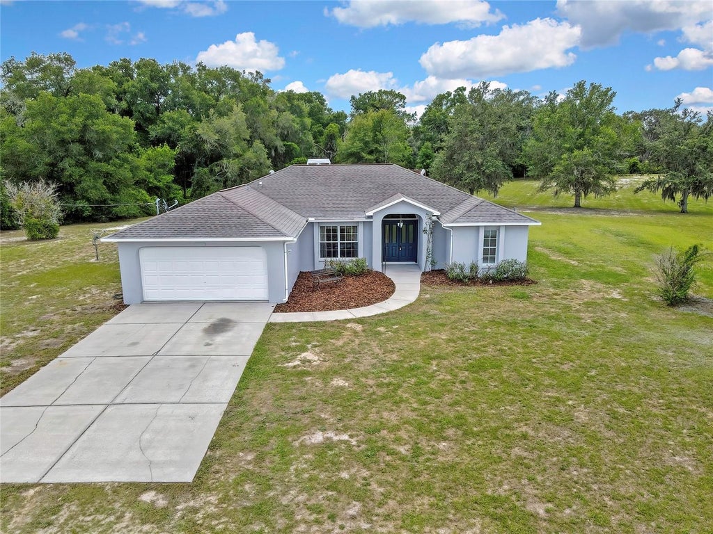 Photo of 20136 Twin Oaks Road, Spring Hill, FL 34610 (MLS # TB8518077)