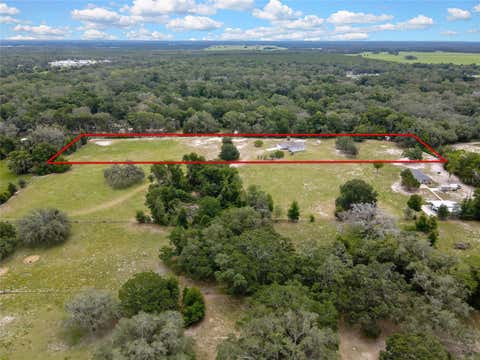 Photo of 20136 Twin Oaks Road, Spring Hill, FL 34610 (MLS # TB8518077)