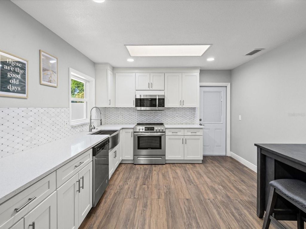Photo of 7910 W Pocahontas Avenue, Tampa, FL 33615 (MLS # TB8503193)