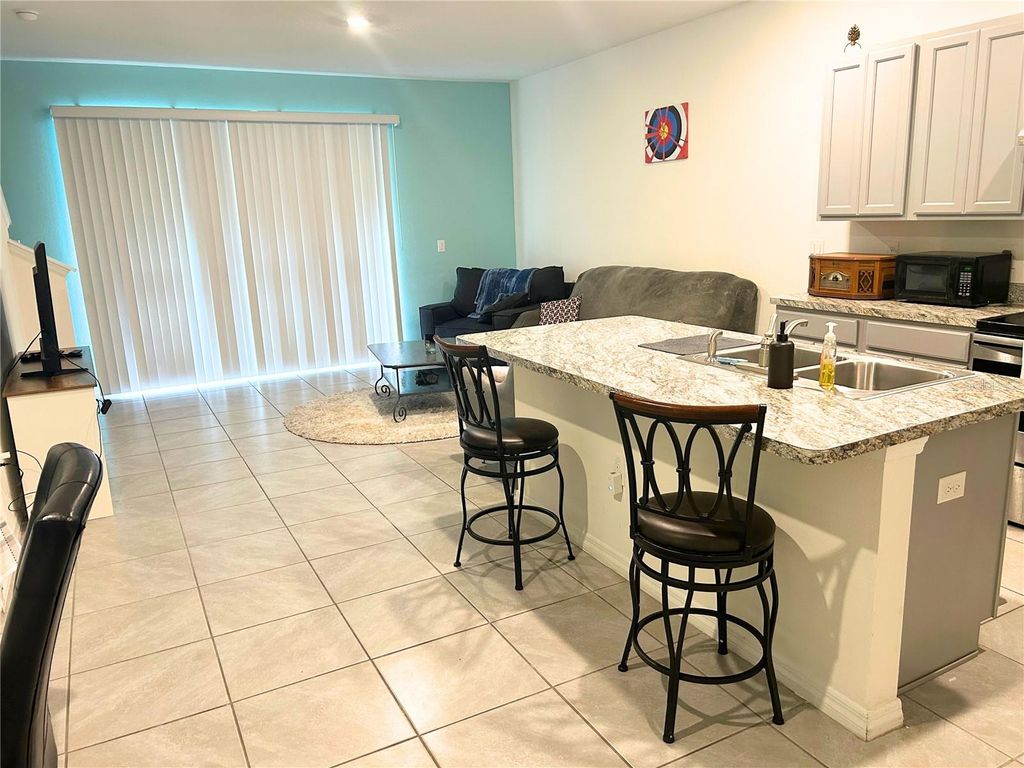 Photo of 305 Feltrim Reserve Boulevard, Davenport, FL 33837 (MLS # O6405882)