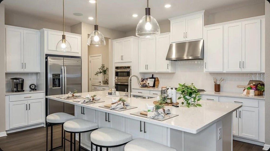 Photo of 443 Junonia Boulevard, New Smyrna Beach, FL 32168 (MLS # O6445565)