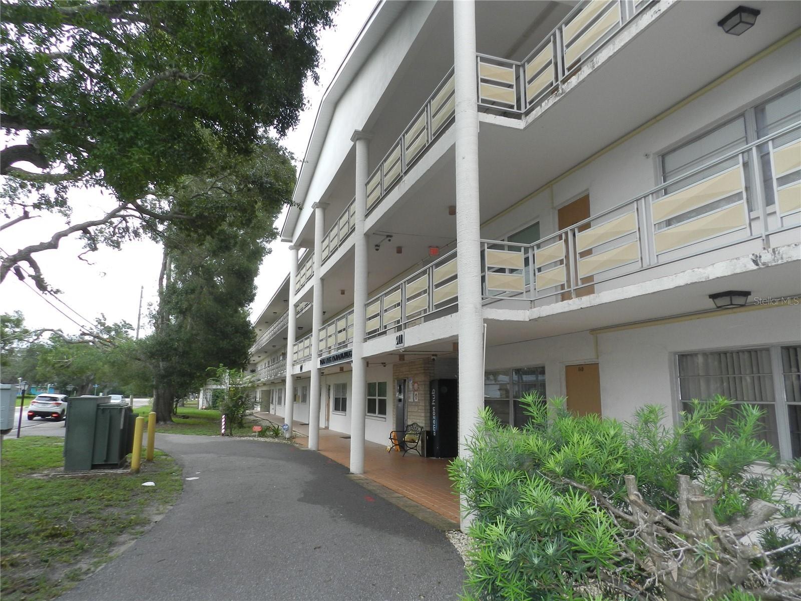 Affordable living is this 2 bedroom 2 bath ground floor condo apt. Freshly painted interior, new vynal plank flooring in the living room and dining room. Move in ready. Covered parking. Low maintenance fee of $457.00 monthly includes common area taxes, escrow reserves, gas for cooking and heating, insurance, exterior maintenance, water, sewer and trash. Community laundry facilities. Leasing is allowed. All ages welcome. Not a 55+ community. Walk to shopping and restaurants. Near the Pinellas trail and Taylor Park. Approximately 22 miles to Tampa International Airport and about 7 miles to St. Petersburg-Clearwater International Airport. All room dimensions are estimated. Buyer should measure all rooms for exact sizes and verify all printed information.