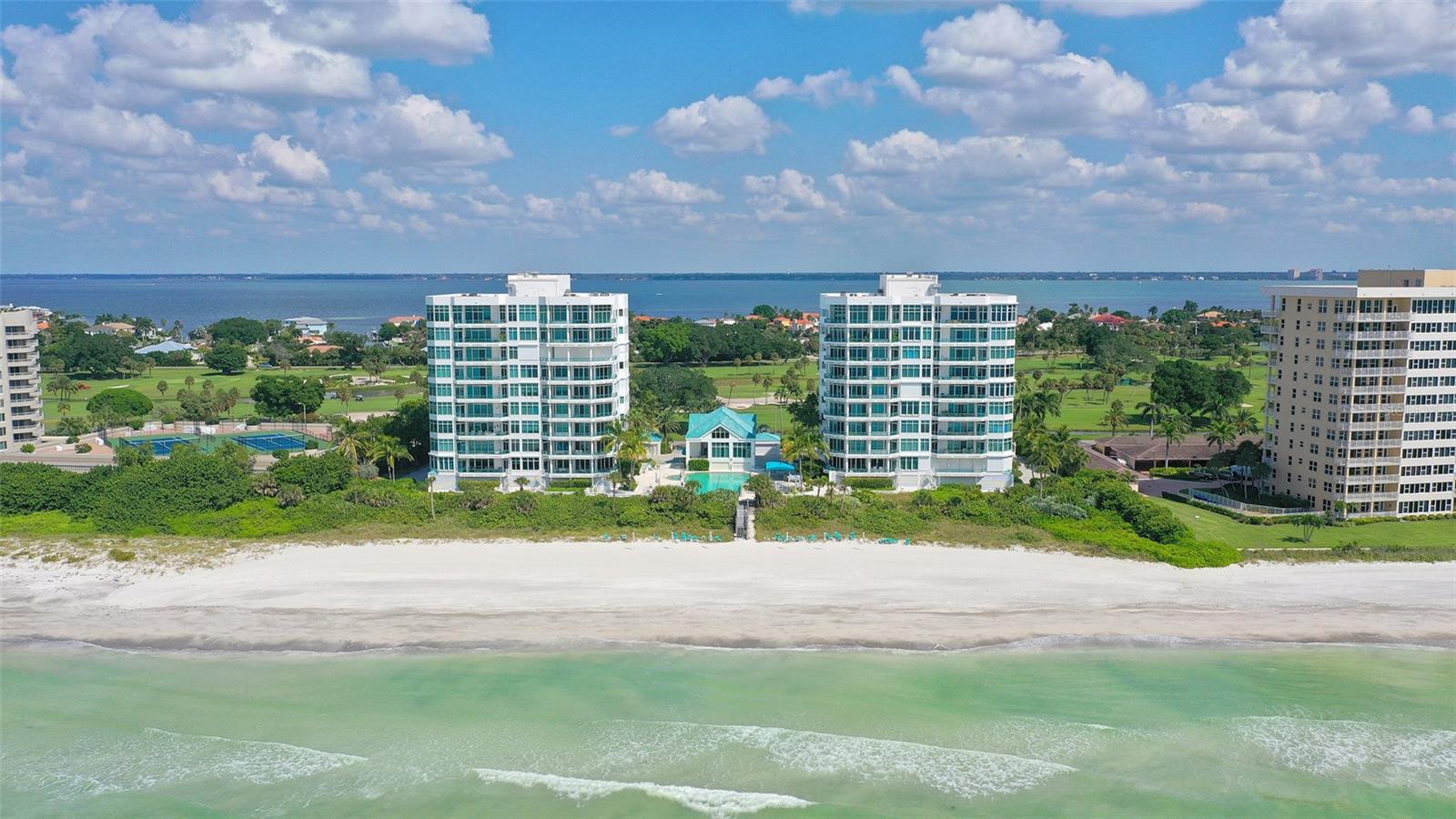 Spectacular Gulf front location! Rarely available A floorpan Three bedroom, three bath direct beach corner residence with southern exposure with vistas to the beach, azure Gulf waters and sunsets plus views of the Longboat key Club golf course, Sarasota Bay and downtown Sarasota lights. Sunrise, sunsets are all enjoyed from this third floor spacious, open floor plan. A private, secured elevator opens to the interior of the residence while a separate elevator brings guests to the front door. Special features of this luxurious residence include 10' foot ceilings, floor to ceiling sliding glass doors, 8' solid mahogany doors plus porches on east and west side of this 3400 sq.ft. home. The kitchen has a wonderful center island plus a breakfast room. The master suite has expansive walls of windows enhancing the gulf views. The master bath is appointed with marble floors and walls, dual vanities and spa tub. Regent Place offers 24 hour security, a 25 -meter heated pool and spa overlooking the Gulf, summer kitchen by the pool, club house with social room and fitness center.