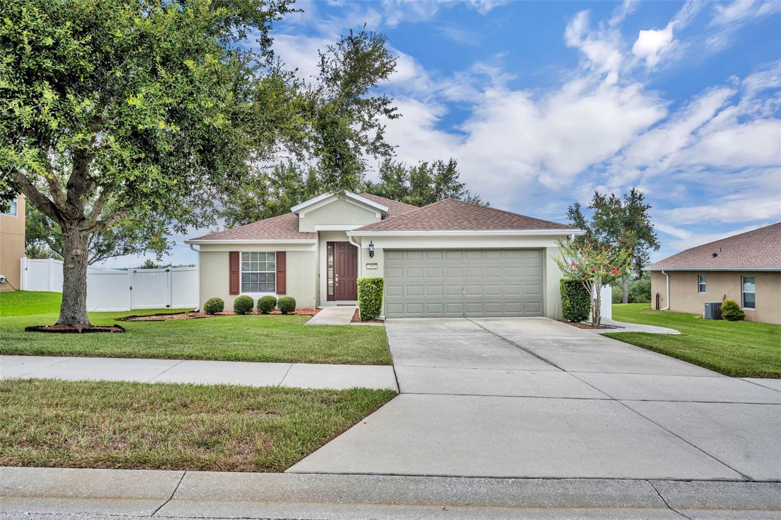 One or more photo(s) has been virtually staged. A Clermont Home Designed for Everyday Comfort & Evening Sunsets
Discover a home where style, function, and location all come together. This 4-bedroom, 2-bath residence in the desirable Verde Ridge community sits on an oversized lot with one of the best views in the neighborhood— Still Lake stretching out behind you and sunsets that never disappoint.
Inside, you’ll find a home that has been carefully maintained and thoughtfully updated. The open layout features **luxury vinyl plank and tile floors throughout—no carpet anywhere—**paired with updated light fixtures and modern ceiling fans for a fresh, polished look. The kitchen is a true highlight, offering GE appliances (including a brand-new refrigerator) and a KitchenAid dishwasher, plus plenty of storage and a bright breakfast area with water views.
The floor plan separates the bedrooms for privacy, with the primary suite tucked away at the back of the home. A spacious walk-in closet and a private bath provide a retreat-like feel, while the additional bedrooms allow room for guests, family, or a home office.
Step outside and you’ll see why this property is special. A large screened lanai and additional paved patio create the perfect space for entertaining or simply enjoying the outdoors. The fully fenced backyard offers both security and flexibility, whether you want to host gatherings, play, or relax under the shade of mature trees.
Practical updates add peace of mind as well—new roof and water heater in 2022—while Verde Ridge offers amenities like a community pool, playground, and walking trails. Best of all, the location is hard to beat: just minutes from shopping and dining, with quick access to the Florida Turnpike, making downtown Orlando and theme parks an easy drive.
This isn’t just a house; it’s a lifestyle. Move-in ready, beautifully updated, and perfectly positioned—your Clermont sunset awaits.