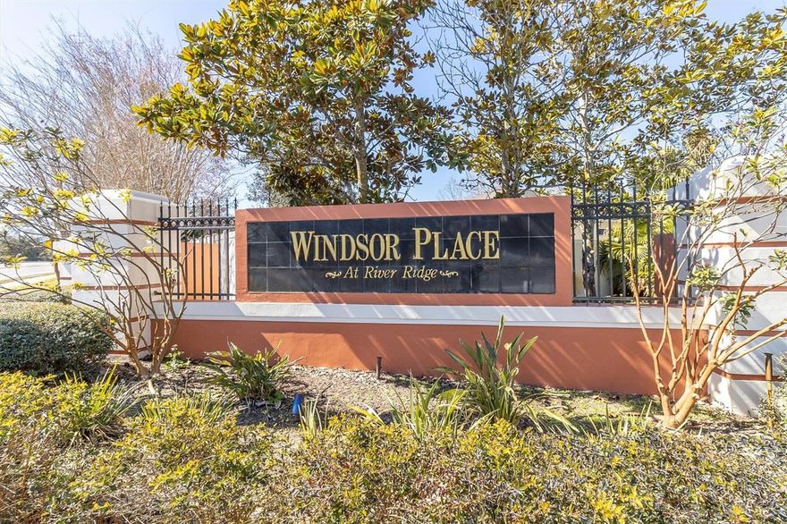 Experience exceptional privacy and comfort in this former model villa located in the gated community of Hampton Village at River Ridge. With no rear neighbors and serene conservation views, this home offers a peaceful retreat in a highly desirable setting.

This thoughtfully designed residence features 2 bedrooms, 2 bathrooms, and a versatile bonus room ideal for a home office or flex space. As a former model home, it showcases numerous upgrades, including elegant tray ceilings in both the living room and the primary suite. Another added upgrade is Impact windows . No having to put up cumbersome shutters here ! 

The kitchen is well-appointed with matching stainless steel appliances, including a refrigerator and microwave that are only three years old. Solid wood cabinetry provides ample storage, complemented by generous counter space and a convenient breakfast bar—perfect for casual dining and entertaining.

The spacious primary suite overlooks the tranquil conservation area and easily accommodates a king-sized bed. It includes a walk-in closet and a private en-suite bath with dual vanities. Additional highlights include an interior laundry room and an attached two-car garage for added convenience.

Residents enjoy low HOA fees and no CDD fees. The low-maintenance lifestyle includes lawn care, irrigation, trash service, grounds maintenance, and exterior building maintenance, including the roof. Hampton Village also offers a gated entrance, community pool and cabana, and guest parking.

Ideally situated near the new Moffitt Cancer Center, VA facilities, Publix, CVS, local restaurants, Pasco-Hernando State College, Starkey Park, and more, this home combines privacy, convenience, and effortless Florida living.