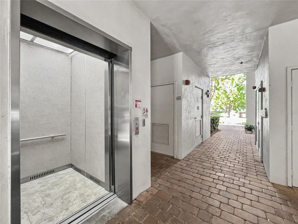 Photo of 909 Waterside Lane #206, Celebration, FL 34747 (MLS # O6404835)