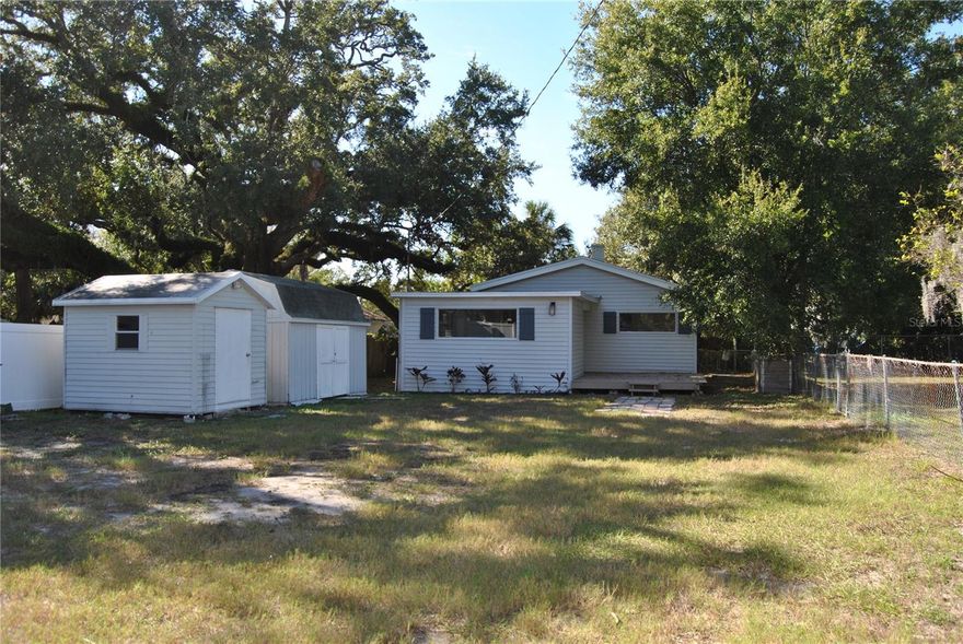 Move in ready 3 bedroom 1 bath on a large lot (just under 1/4 acre.) Fresh paint. New wood laminate floors throughout. Electric fireplace in living room. Closet and ceiling fans in all bedrooms. Nice large windows for natural lighting. Large open upgraded kitchen with stone countertops, stainless steel refrigerator, dishwasher, stove and microwave. Pantry. Eat-in space in kitchen. 2 large storage shed which offers plenty of room for storage and washer and dryer hookup. Fenced Yard. Plenty of room for parking. Bring the boat, RV and other toys. All this and more in a highly sought after area, close to entertainment, restaurants, stores, schools and only minutes from downtown and I 275 for an easy commute. Call listing agent today for your private tour before it's gone.