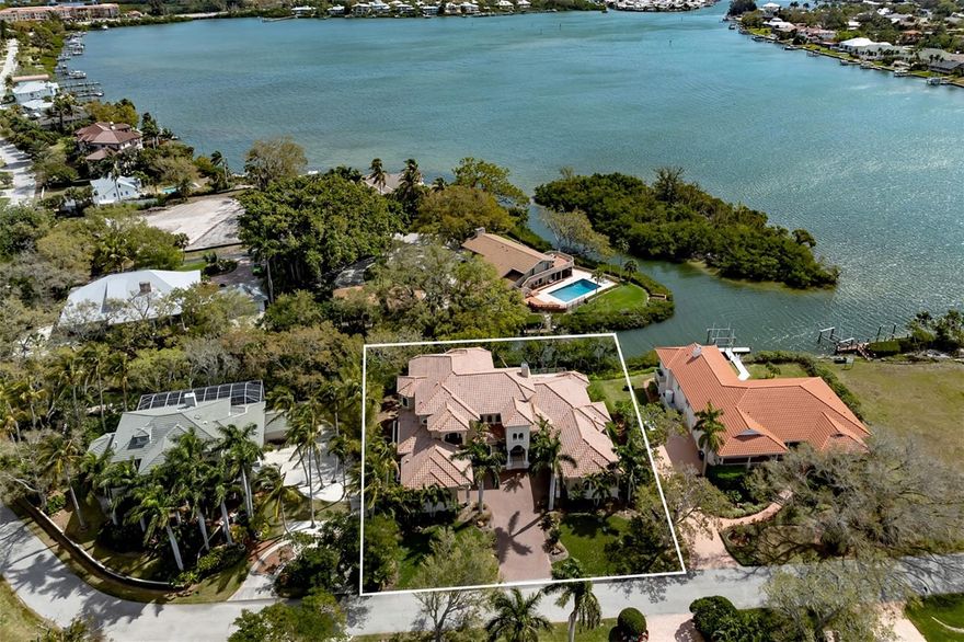 Auction Property. AUCTION – Seller offering property via online auction. Now Selling at or Above the Published Reserve Bid Price of $2.5M! Previously listed for $5.7M. Bid online beginning Monday, April 28th.  weekend begins Friday, April 25th to view this fully furnished home in the Enchanted Isles community along the shores of Roberts Bay, just minutes from historic downtown Venice. This John Cannon-built home offers 4 ensuite bedrooms, 5.5 bathrooms, and refined craftsmanship throughout. Features include a grand foyer with travertine floors and iron staircase, chef’s kitchen featuring professional grade appliances such as Sub-Zero refrigerator, Wolf dual-fuel range, dual dishwashers, wet bar, wine room, and expansive living spaces filled with natural light. The primary suite boasts a fitness room, spa-like bath, water views, and private courtyard, while a separate guest suite with private entry and kitchenette provides additional privacy. Upstairs includes two ensuite bedrooms, a powder bath, billiards room, and family room with terrace overlooking the bay and Intracoastal. Outdoor living features a saltwater pool and spa, summer kitchen, fireplace, and a 10,000 lb. boat lift with dock—just five minutes to the Gulf with no bridges. Close to dining, shopping, golf, top medical care, cultural attractions, and world-class beaches. Contact agent or Interluxe.com for full terms and conditions of the sale and schedule appointment to preview the home.