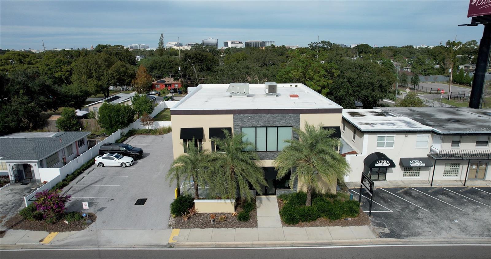 Two story office building in the desirable Westshore/South Tampa District, also included in the sale is an attached 0.12 acre residential lot (which can be used as additional parking). As you enter the parking lot, you are greeted with 17 parking spots to choose from with 6 covered spaces from the Florida elements and 2 pre-wired charging stations for electric cars.
As you enter the lobby, the building invites you in with a decorated accent ceiling, tall glass doors and a warm front lobby space for visitors. Lots of detail and attention went into the construction of this building.
On the first floor of the building, the bright reception area has two entrances - one from the street and one from the parking area. the remainder of the first floor is comprised of an open plan area with a kitchenette and two bathrooms.
Make your way to the second floor via elevator or metal staircase. As you enter the second floor, you immediately face the conference room with an oversized grand glass double door entrance. To the left of the conference room you are greeted with several large windows allowing natural light to shine into the space. The remainder of the second floor includes a intimate reception area, oversized shared central desk space, kitchenette, two additional bathrooms and 4 private offices to include one oversized space for whoever is in charge.
Easy access from I-275, and local routes. Close proximity to everything Tampa has to offer; 0.6 miles from Midtown, 4 miles from Tampa International Airport, 3.9 Miles from Downtown Tampa. Contact District Home Group to schedule your showing today!
***Seller Financing available up to $1,000,000*** (with an acceptable offer).