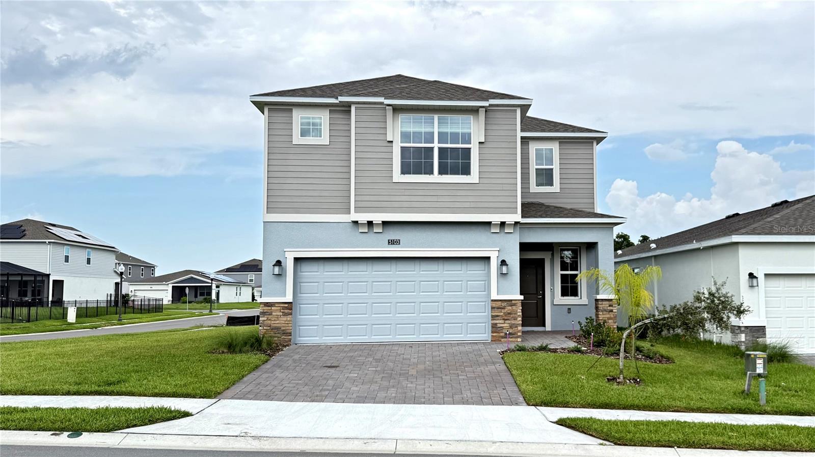 Be the very first to call this stunning 4-bedroom, 2.5-bathroom home yours! This newly constructed, two-story gem offers 2,334 sq ft of modern living space on a spacious corner lot, perfectly positioned for privacy in a community that's still developing, meaning fewer neighbors and extra tranquility. Step inside and fall in love with the open, airy layout featuring a bright family room seamlessly connected to a stylish kitchen. The chef's kitchen boasts 42” cabinetry, quartz countertops, and brand-new appliances, ideal for everyday meals or entertaining. The dining room flows out to a large covered lanai where you can relax and soak up peaceful views. Upstairs, a versatile loft space awaits, perfect for a home office, playroom, or media nook. The large owner's suite offers a private retreat complete with a spa-inspired bathroom with a massive closet, while three additional bedrooms provide plenty of space for family or guests. Additional highlights include a spacious 2-car garage, brand-new, energy-efficient systems and state-of-the-art security system, and a convenient location next to community mailboxes for easy access. Located in the highly sought-after Providence Golf Club Community, this home offers a resort-style lifestyle with incredible amenities a 24-hour manned gated entrance for peace of mind, resort-style swimming pool and lap pool, fitness center, tennis courts, walking trails, and dog park, and an on-site restaurant serving breakfast, lunch, and dinner. All this, just minutes from major highways and Central Florida's world-famous theme parks! Don't miss your chance to live in Providence, where luxury and active living go hand in hand. Schedule your private tour today!