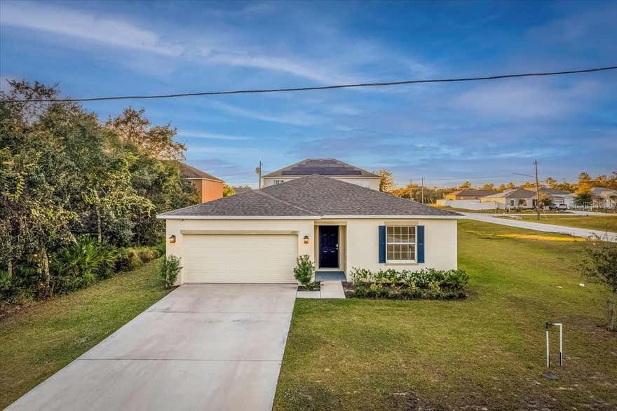 One or more photo(s) has been virtually staged. Move-in ready Maronda Homes Oak “E” model located on a premium corner lot in the growing community of Poinciana Villages! This beautiful 3-bedroom, 2-bath single-story home features an open-concept layout with upgraded Azul Platino granite countertops, Chatham Umber cabinetry, stainless steel appliances, center island, ceramic tile in main living areas, and upgraded carpet padding in bedrooms. The spacious primary suite includes dual sinks, large vanity, and walk-in shower. Additional upgrades include cordless blinds, irrigation system, builder-installed security system, extended 10x20 patio slab, oversized driveway, and 2-car garage. The corner-lot location offers added privacy with no front-facing neighbors and extra yard space. Located in a community with low HOA fees, residents enjoy incredible amenities including community pools, fitness center, sports courts, playgrounds, dog park, picnic areas, boating ramps, hiking trails, aquatic center, and event spaces. Conveniently located near shopping, dining, parks, schools, hospitals, and major roadways, with easy access to Orlando attractions and Disney just approximately 30 minutes away. Move-in ready and includes a structural warranty for added peace of mind.