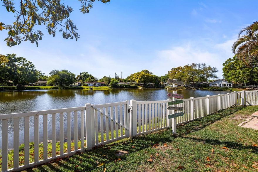Welcome to a rare opportunity to own a lakefront home in Dunedin, Florida, perfectly positioned on the peaceful shores of Lazy Lake with a large, fenced backyard overlooking the water—properties like this are seldom available and offer a unique combination of privacy, location, and lifestyle in one of Tampa Bay’s most desirable coastal communities. This beautifully maintained 3-bedroom, 2-bath home with a 1-car garage features a spacious open floor plan designed for both everyday living and entertaining, with a completely remodeled kitchen (2024) at the heart of the home that seamlessly connects to the great room, creating a bright and inviting central gathering space. The thoughtfully designed layout includes two bedrooms on one side of the home and a private primary suite on the opposite side, offering comfort, functionality, and separation. Step outside to your own slice of Florida paradise where the expansive backyard is fully fenced and framed by mature tropical landscaping, providing both beauty and privacy while overlooking tranquil Lazy Lake—perfect for relaxing mornings, sunset views, or future outdoor enhancements. Major upgrades provide peace of mind, including a new roof (October 2024), hurricane-impact windows and doors (2024), and an HVAC system replaced in September 2021, meaning all the big-ticket items have been taken care of and the home is truly move-in ready while still offering the opportunity to personalize and make it your own. Ideally located in the heart of Dunedin, this home is just minutes from downtown Dunedin’s charming shops, restaurants, breweries, and waterfront parks, and is conveniently close to the post office, shopping, world-class Gulf beaches, Honeymoon Island, and two international airports (Tampa International Airport and St. Pete–Clearwater International Airport), making travel and daily living exceptionally convenient. Whether you are searching for a primary residence, seasonal retreat, or waterfront investment property, this is a standout opportunity in the Dunedin waterfront market—lakefront homes like this do not come available often, and this one is ready for its next owner to enjoy.